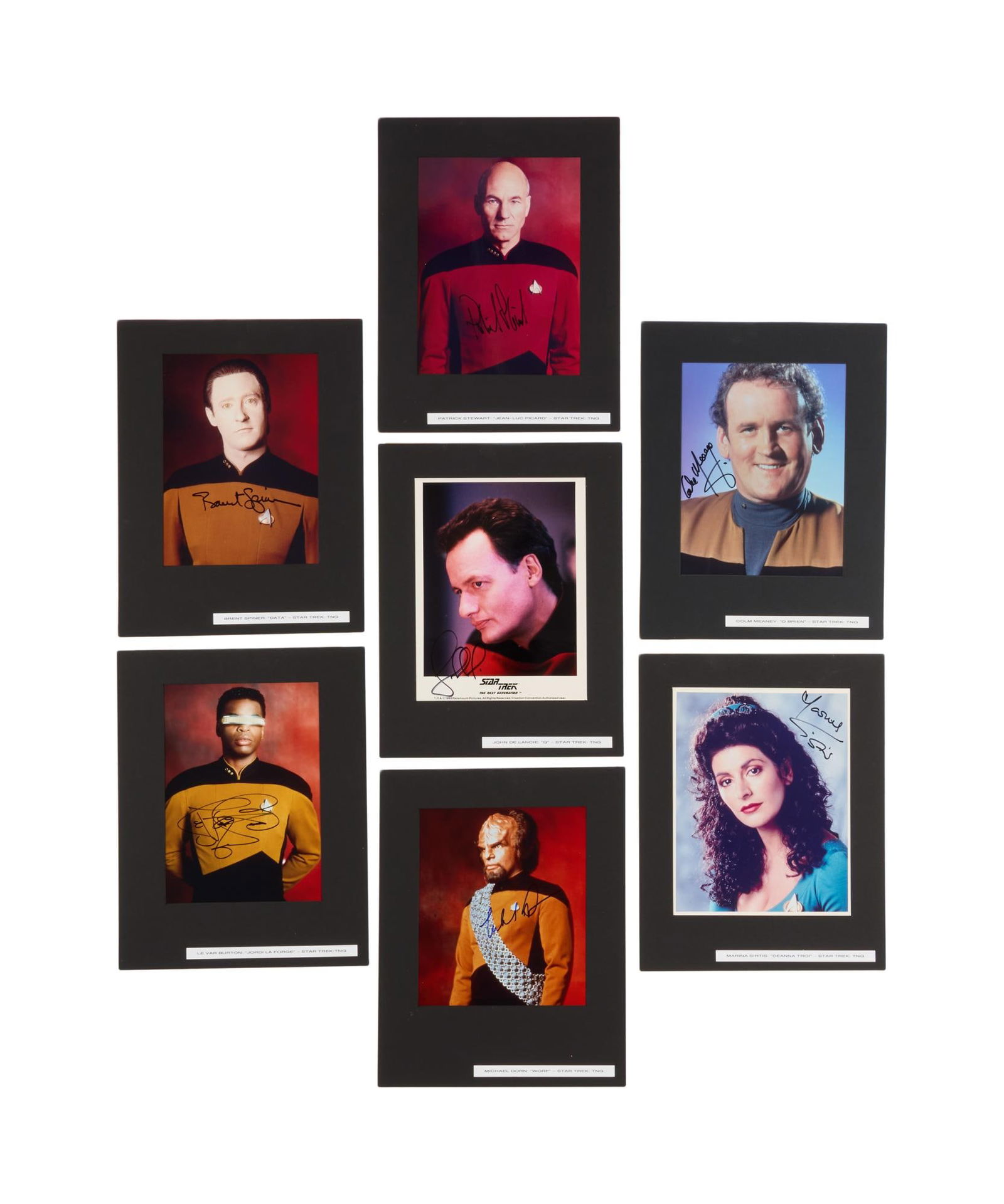 Star Trek: The Next Generation | Group of Signed Cast Photos: A group of seven color publicity photos signed by various cast members of Star Trek: The Next Generation (Paramount Television, 1987-1994), including Patrick Stewart, Brent Spiner, Levar Bur