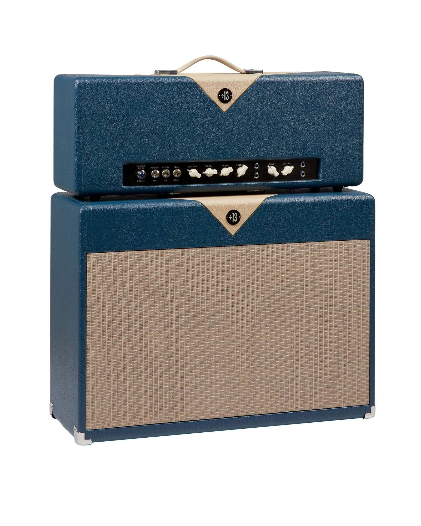 Joe Walsh | Stage Played Divided by 13 FTR37 Guitar Amplifier Head and 2x12 Inch Speaker Cabinet: A Divided By 13 FTR 37 guitar amplifier head with matching speaker cabinet, both housed in individual grey road cases and coverd in blue and white tolex with gold piping and wheat grille, with an illu