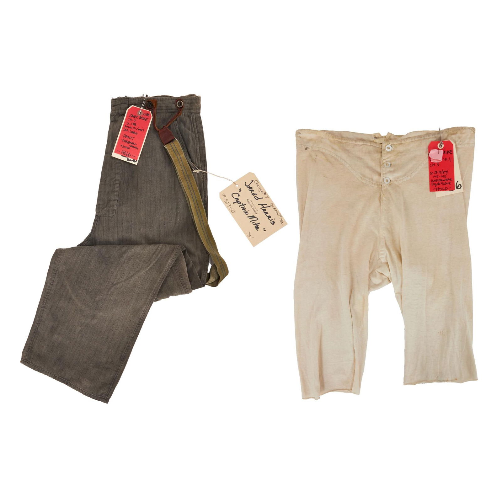 The Curious Case of Benjamin Button | Captain Mike Clark (Jared Harris) Pants and Undergarments: A pair of pants and undergarments worn by Jared Harris as Captain Mike in The Curious Case of Benjamin Button (Paramount, 2008). The pants are a charcoal gray fabric with a herringbone pattern and two