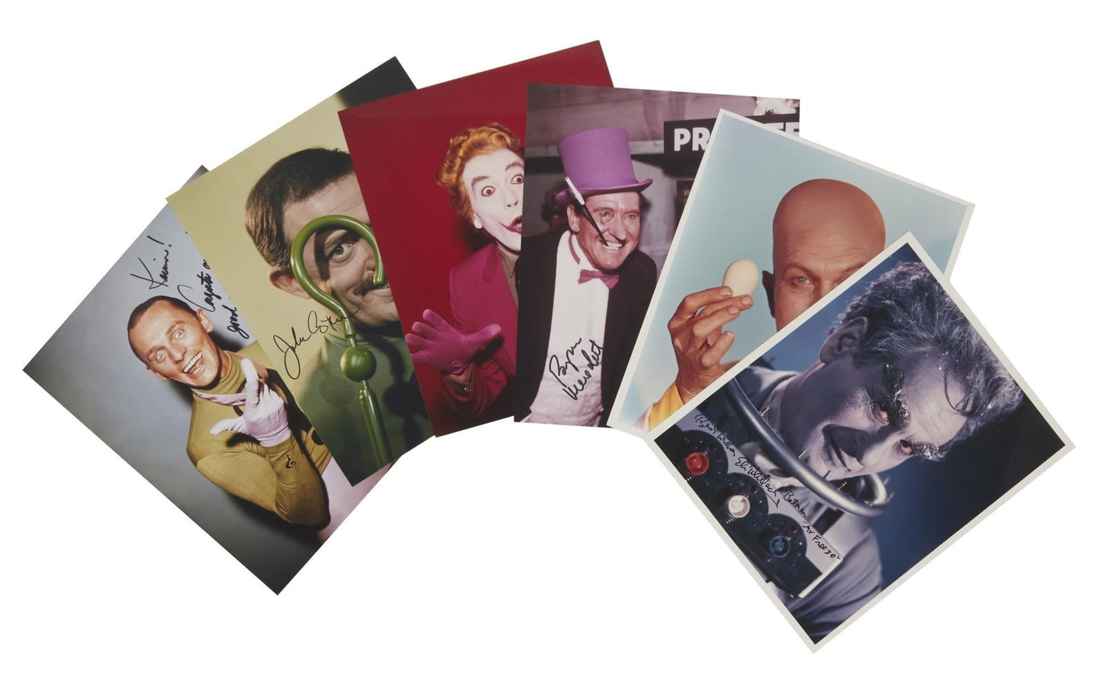 Batman | Villains Signed Photos by Frank Gorshin, Cesar Romero, Burgess Meredith, and More: A group of six signed color photographs by actors who portrayed iconic villains on the series Batman (ABC, 1966-68), including Egghead (Vincent Price), The Penguin (Burgess Meredit