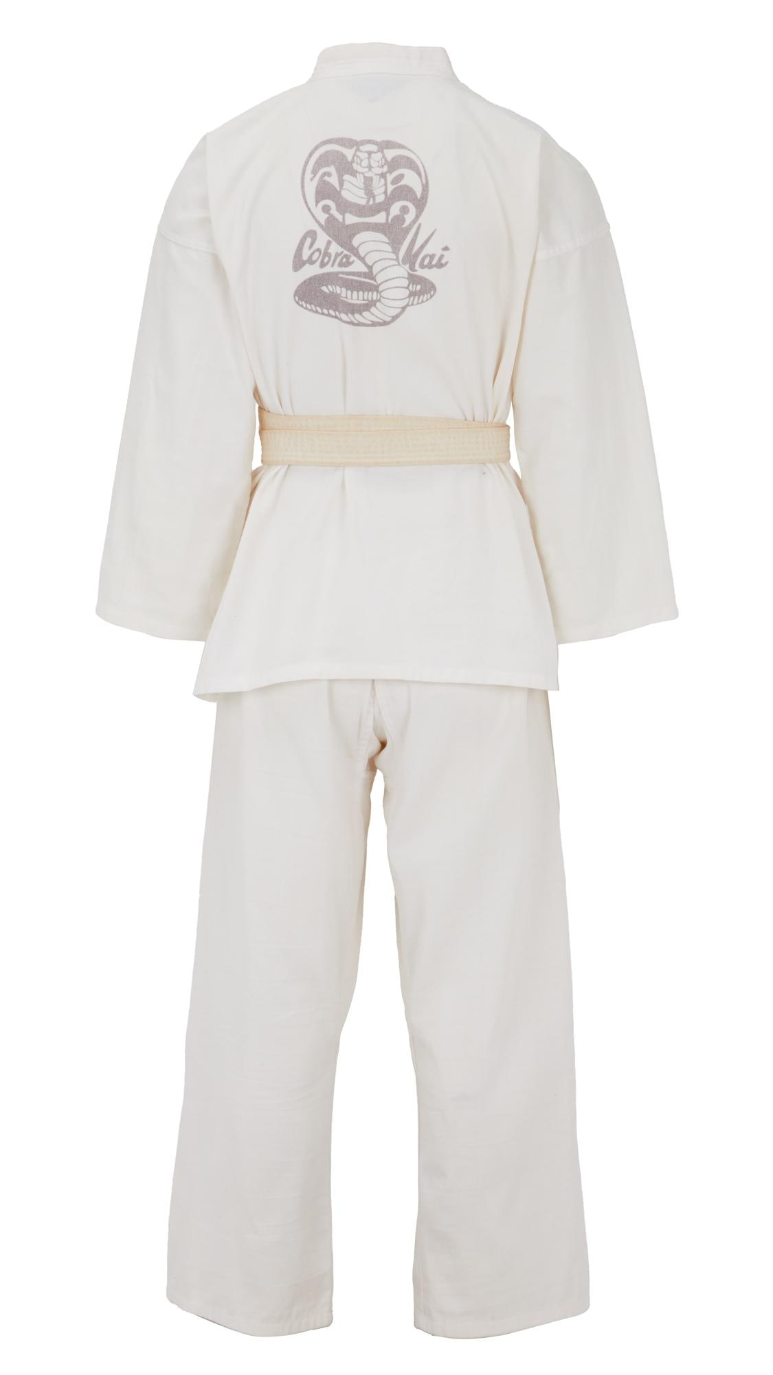 Cobra Kai | Miguel Diaz (Xolo Mariduena) Cobra Kai Gi Ensemble: A white karate gi ensemble worn by Xolo Maridueña in his role as Miguel Diaz in the Emmy-nominated television series Cobra Kai (YouTube/Netflix, 2018-2025). The gi consists of a white top,