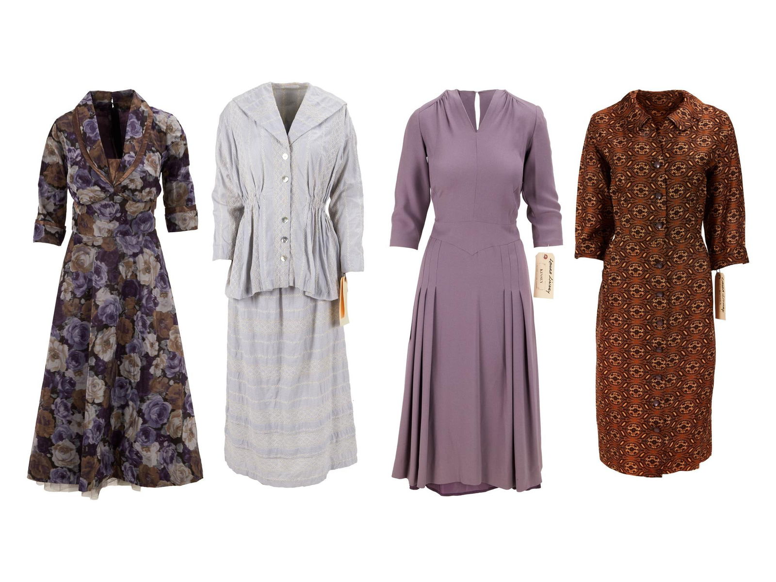 Kinsey | Clara McMillen (Laura Linney) Cocktail Dresses: A set of dresses worn by Laura Linney as "Mac" in the biopic Kinsey (American Zoetrope, 2004). The first dress is cocktail length in a lavender crepe fabric, with a v-neck, 3/4-length sleeve