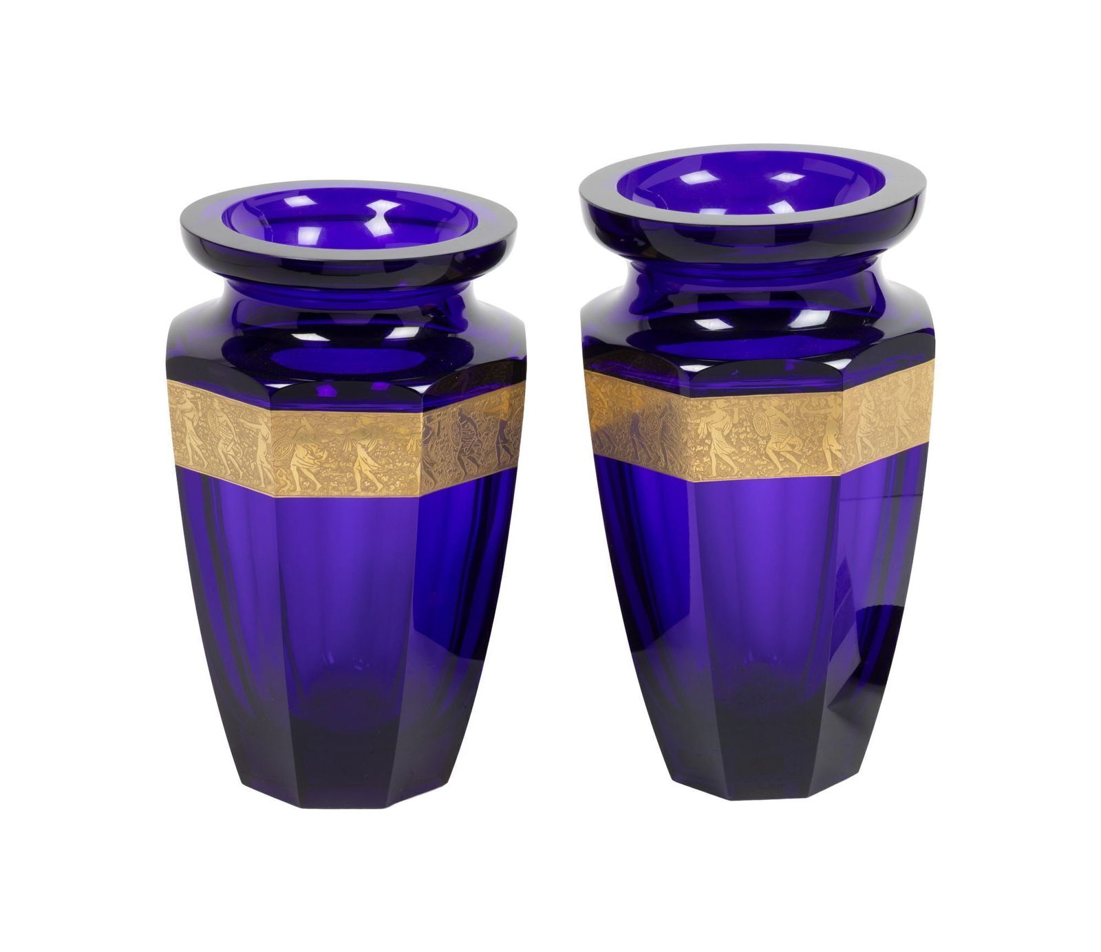 Whoopi Goldberg | Two Moser Cobalt and Parcel Gilt Vases: Two tall Moser faceted cobalt glass vases with gilt cameo friezes, marked with labels. Taller 13.25 x 8 inches From the Collection of Whoopi Goldberg