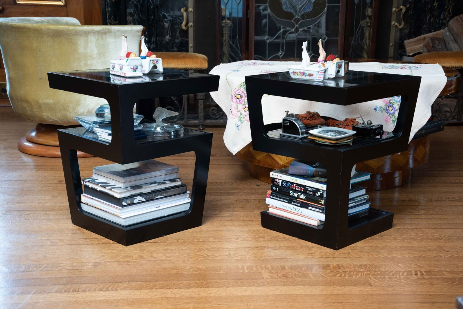 Whoopi Goldberg | Pair of Dwell Three Layer Side Tables: A pair of Dwell triple level occasional tables with glass tiers. 22 x 17 x 17 inches From the Collection of Whoopi Goldberg