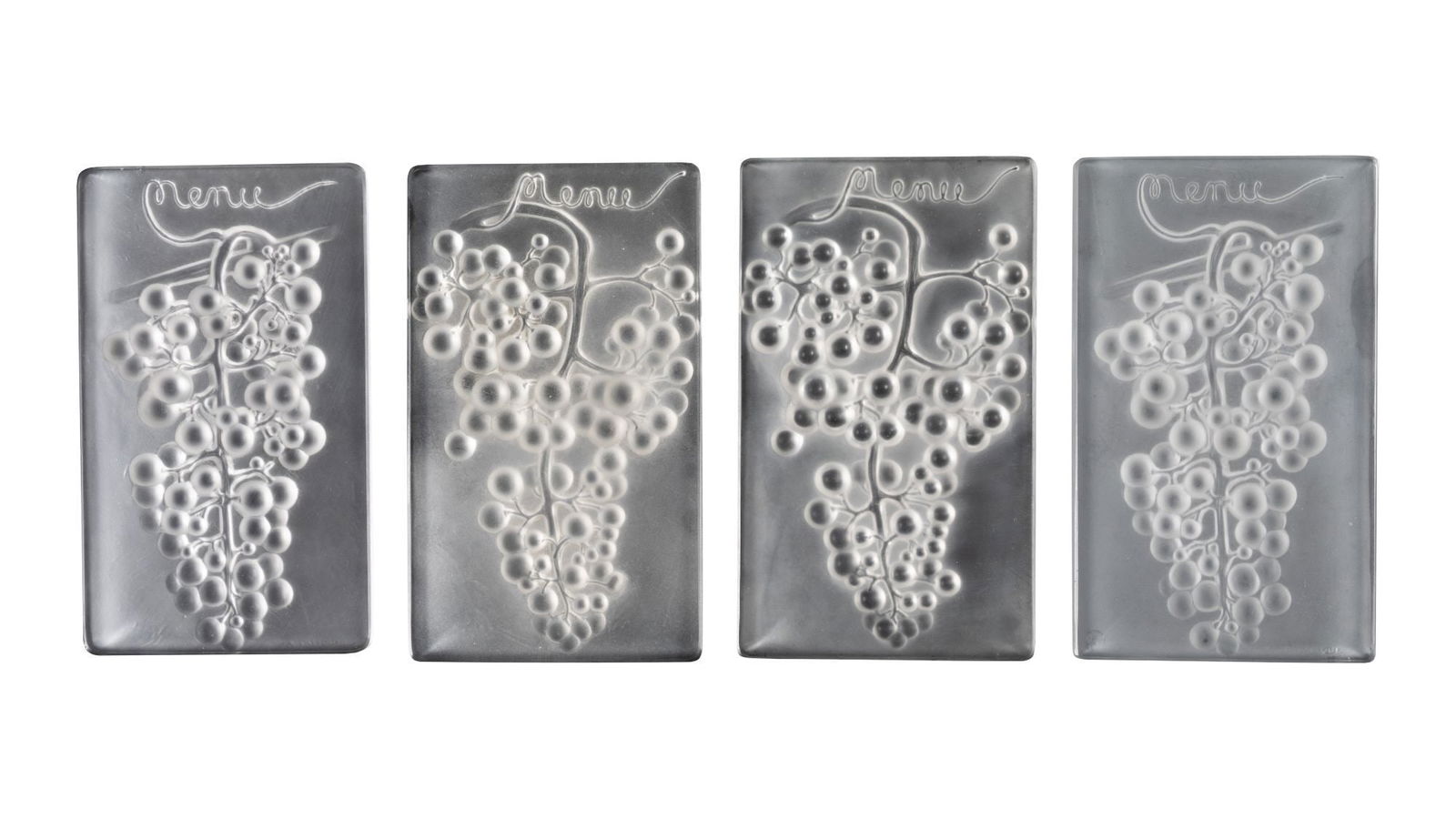 Whoopi Goldberg | R. Lalique Four Raisin Chasselas Menus: A group of four clear and frosted molded glass menus, originally designed in 1925. With engraved "R. Lalique France No. 3476" mark. LITERATURE: Marcilhac no. 3476. 6 x 3.5 inches From the Collection o