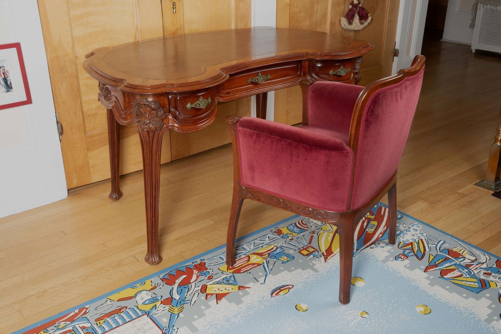 Whoopi Goldberg | French Art Nouveau Paul Alexandre Dumas Desk and Georges de Feure Chair: A French Art Deco mahogany and bronze desk by Paul Alexandre Dumas, exhibited in the Exposition Universelle, 1900. Together with a French Art Nouveau velvet upholstered mahogany armchair with foliate
