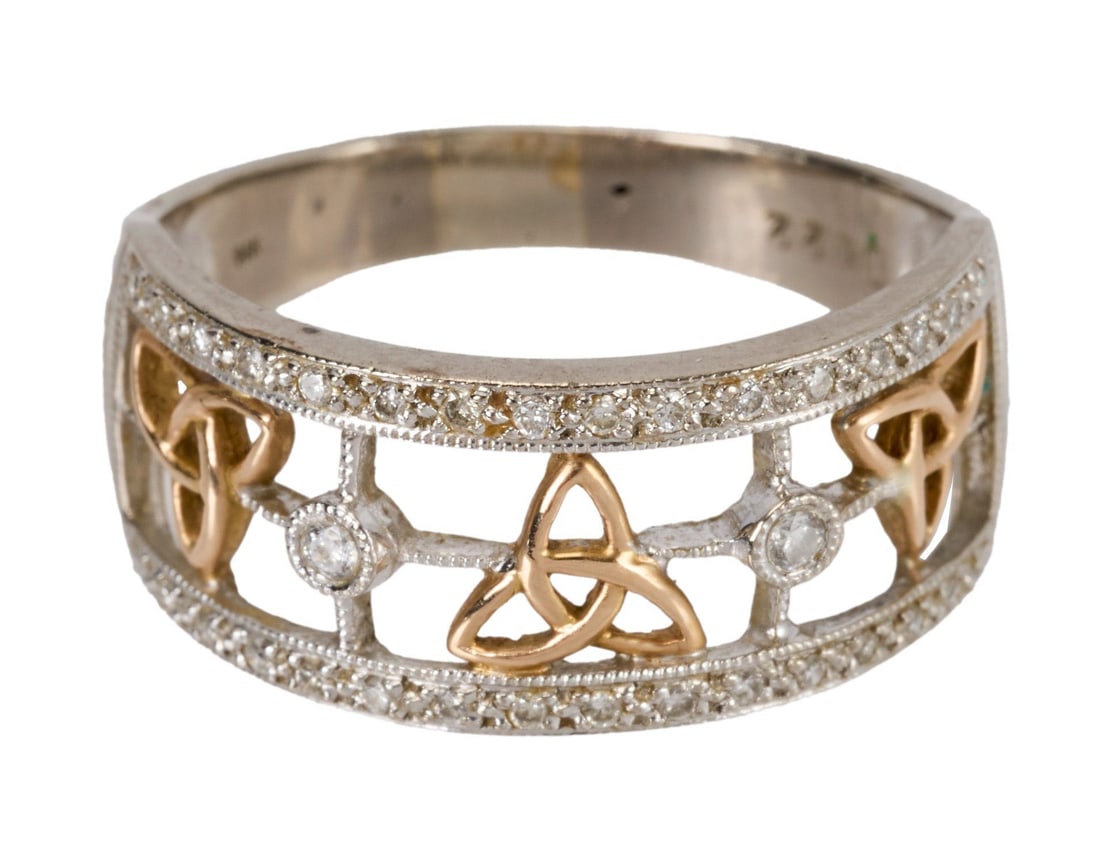 Whoopi Goldberg | 14k White and Rose Gold and Diamond Ring Band: The openwork band set with three rose gold trinity knot motifs to the circular-cut diamond borders and polished half hoop, 4.7 grams, ring size 8.5.Marked 14k and D022.Condition: 34 circular