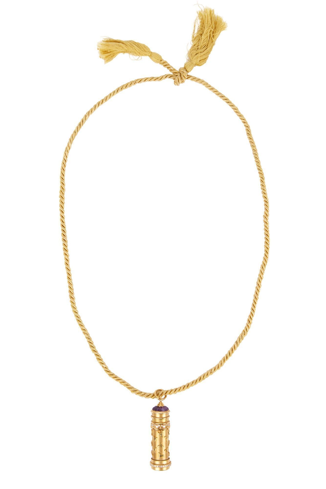 Whoopi Goldberg | Harry Winston 18k Yellow Gold and Diamond Novelty Kaleidoscope Pendant Necklace: The matte and polished 18k yellow gold cylindrical kaleidoscope, accented by circular-cut diamonds, the screw on top decorated with buff-topped calibré- cut amethyst, suspended by a gold&nb