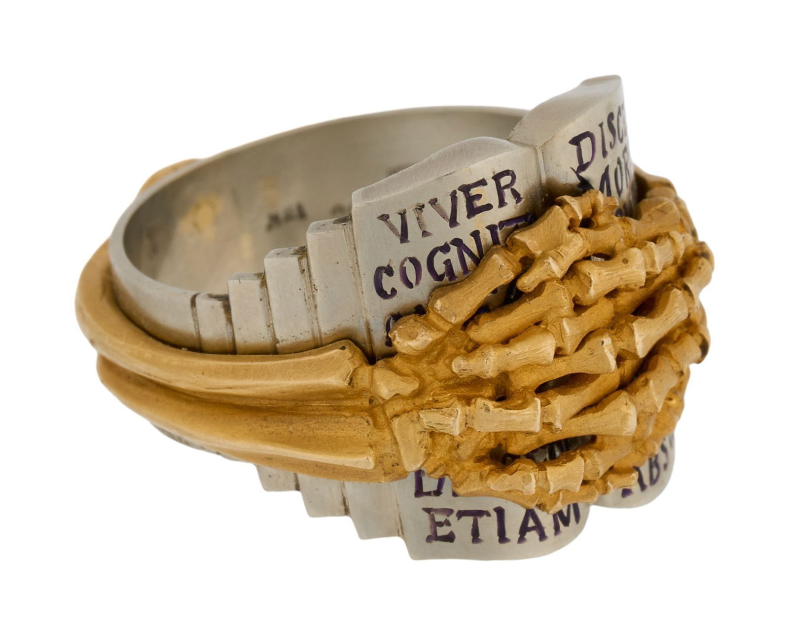 Whoopi Goldberg | 14k and 18k White and Yellow Gold Sculptural Ring Band: Designed as a pair of clasped yellow gold skeleton hands partially obscuring a white gold book in Latin, 16.4 grams, ring size 8.Marked KM 14k 18k. From the Collection of Whoopi Goldberg