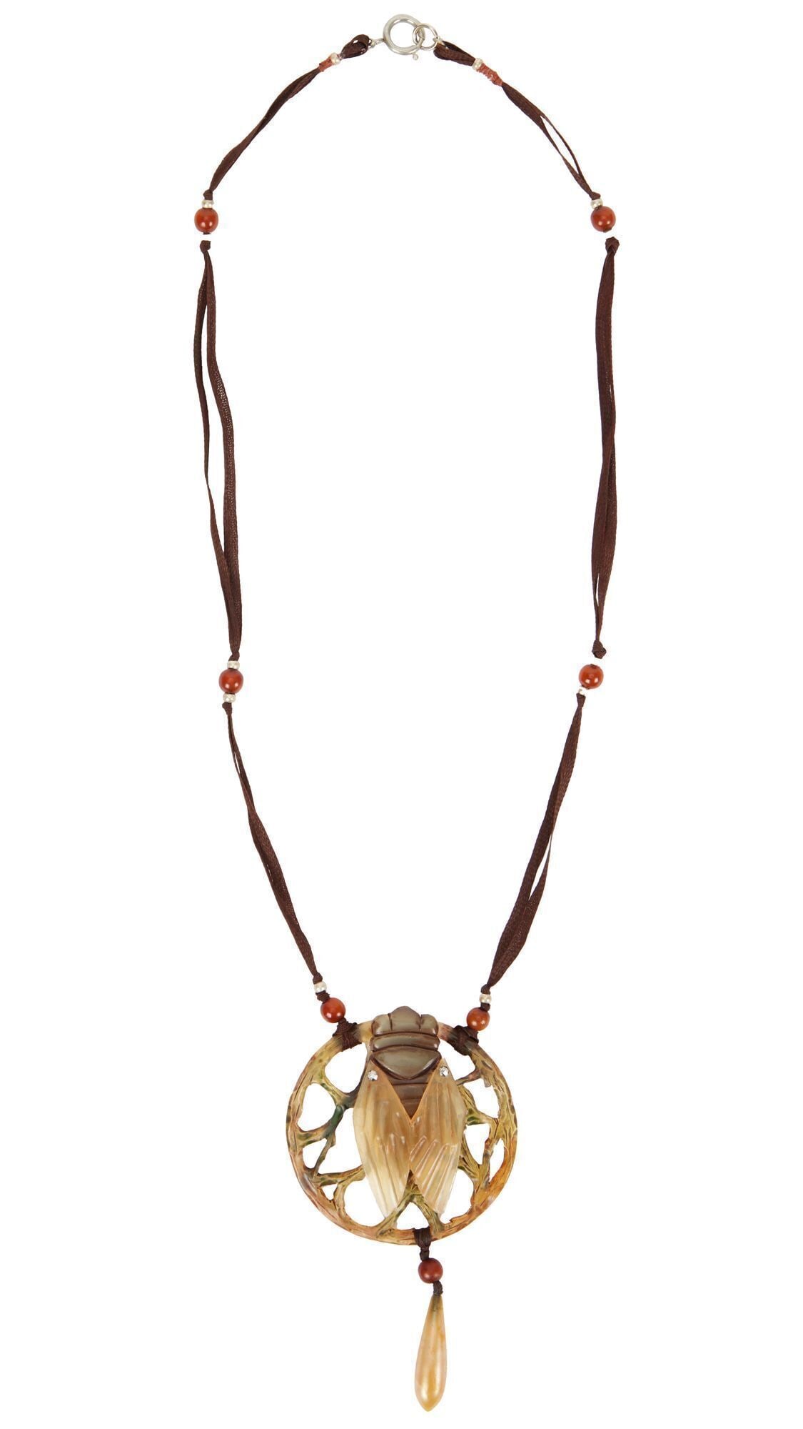 Whoopi Goldberg | Carved Cicada Pendant Necklace: The large sculptural pendant centering upon a sculpted cicada on an openwork organic plaque, suspended from a silk ribbon necklace, accented by amber beads, attributed to Elisabeth Bonte with indistin