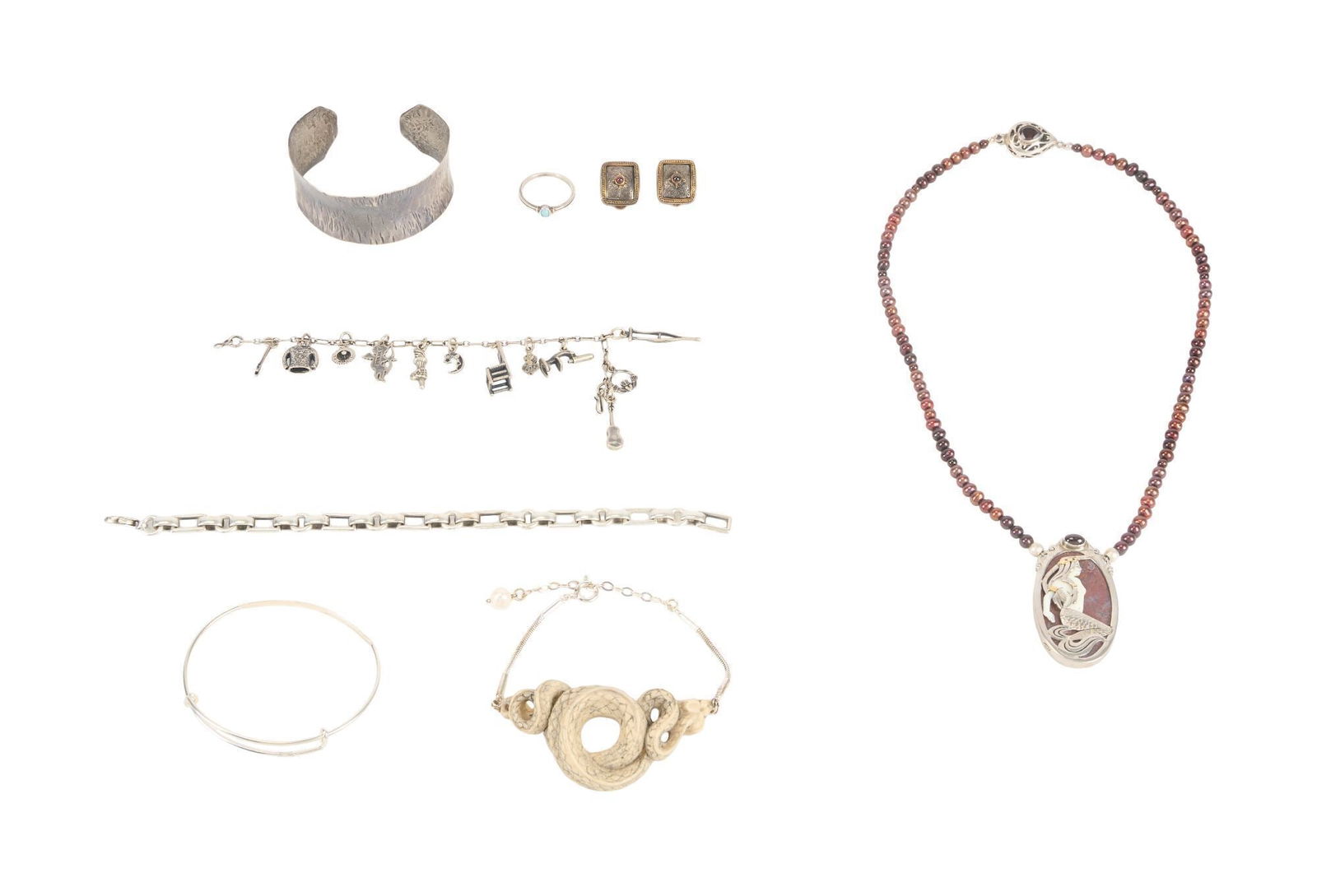 Whoopi Goldberg | Sterling Silver Jewelry: Comprising:- A hammered sterling silver cuff bracelet, 17.9 grams, 2 1/8 inch inner diameter unmarked.- A pair of Konstantino sterling silver and 18k yellow gold ear clip