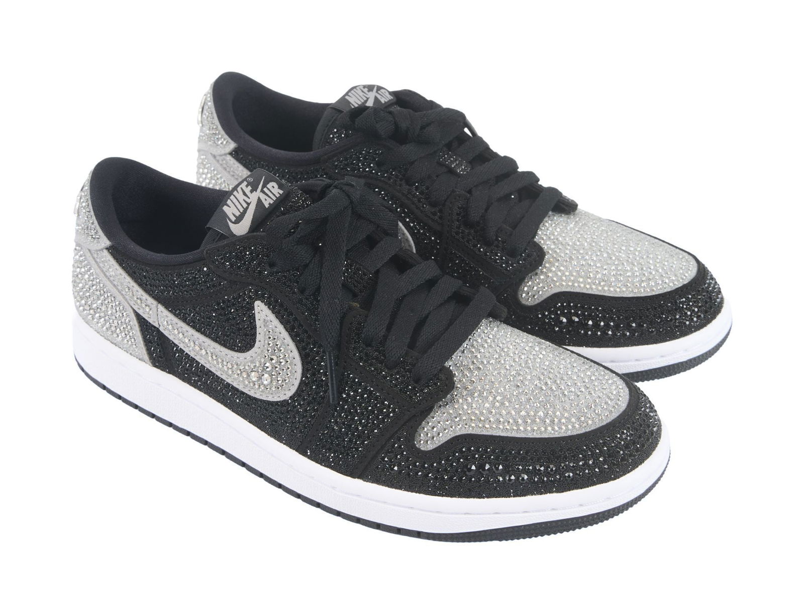 Whoopi Goldberg | Nike Air Force One Retro Low Swarovski Stealth:  A pair of Nike Air Force One Retro Low Swarovski Stealth trainers (or "Uptowns," as New Yorkers call them) covered with jet-like and white crystals. US size 9. From the Collection of Whoopi Gold
