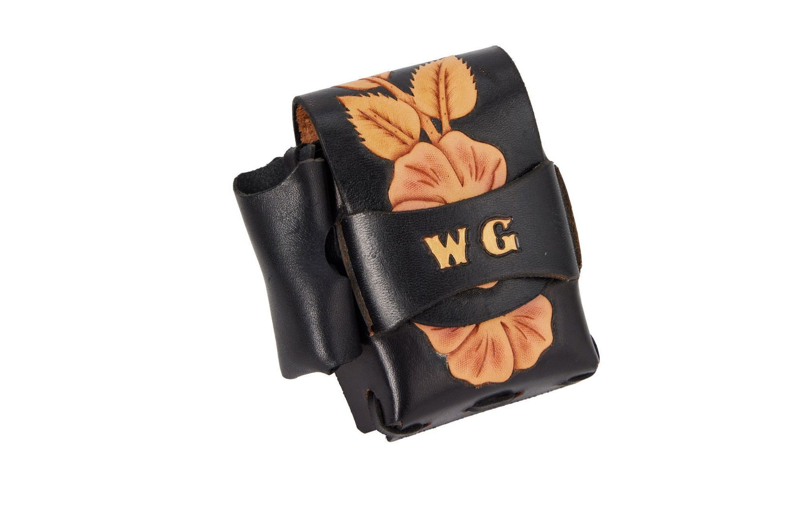 Whoopi Goldberg | Monogrammed Leather Cigarette Case: A custom-made black leather cigarette case with a side pocket for a lighter. The case is embossed with flowers and a gold-colored "WG." No maker's mark present. 5 x 4.5 x 1.5 inches From the Collectio