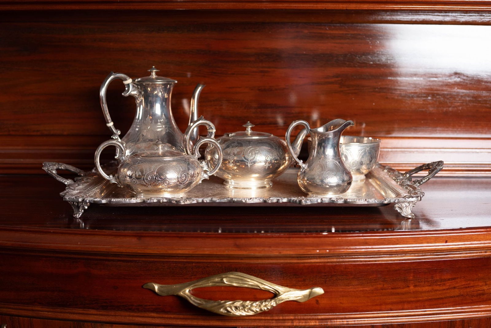 Whoopi Goldberg | Six-Piece Silver Plated Tea Service Retailed by Tiffany & Co.: A vintage six-piece silver plated tea service by Hawksworth Eyre & Co., including a coffee pot, tea pot, cream jug, sugar bowl, waste bowl, and tray, retailed by Tiffany & Co. Marked "EP" and "9580" o