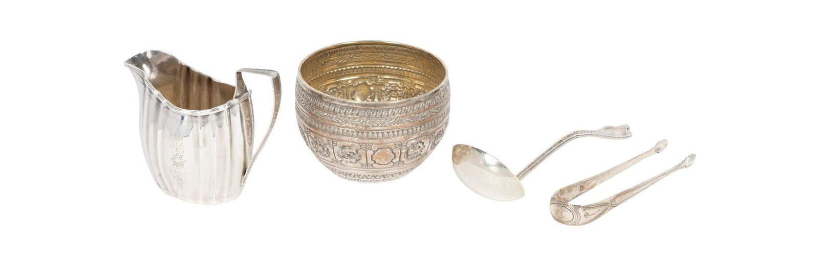 Whoopi Goldberg | Goup of Four Sterling Tableware Articles: A group of four antique sterling tableware items, including a Zodiac sugar bowl with hallmarks for London, 1876; an unassociated sugar tongs with a London hallmark; a Georgian cream pitcher with fluti