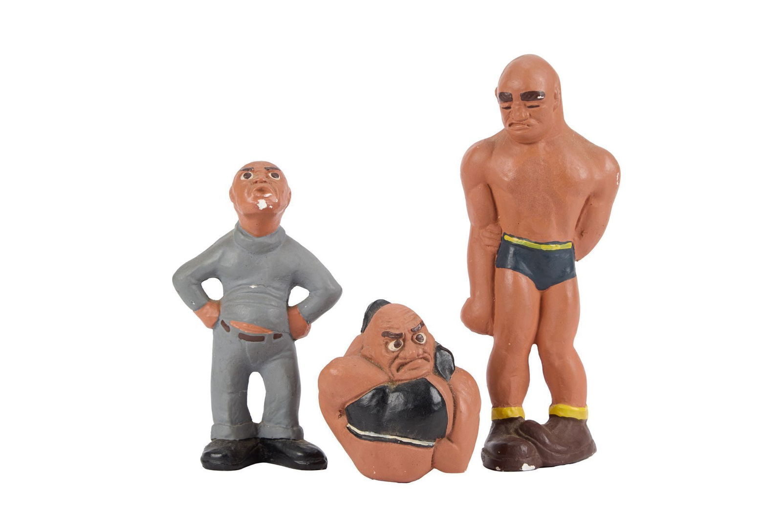 Whoopi Goldberg | Three Vintage Wrestler Figurines: A set of three vintage chalkware Lafayette Rittgers wrestler figurines marked 1941. Largest 9 x 4 inches From the Collection of Whoopi Goldberg