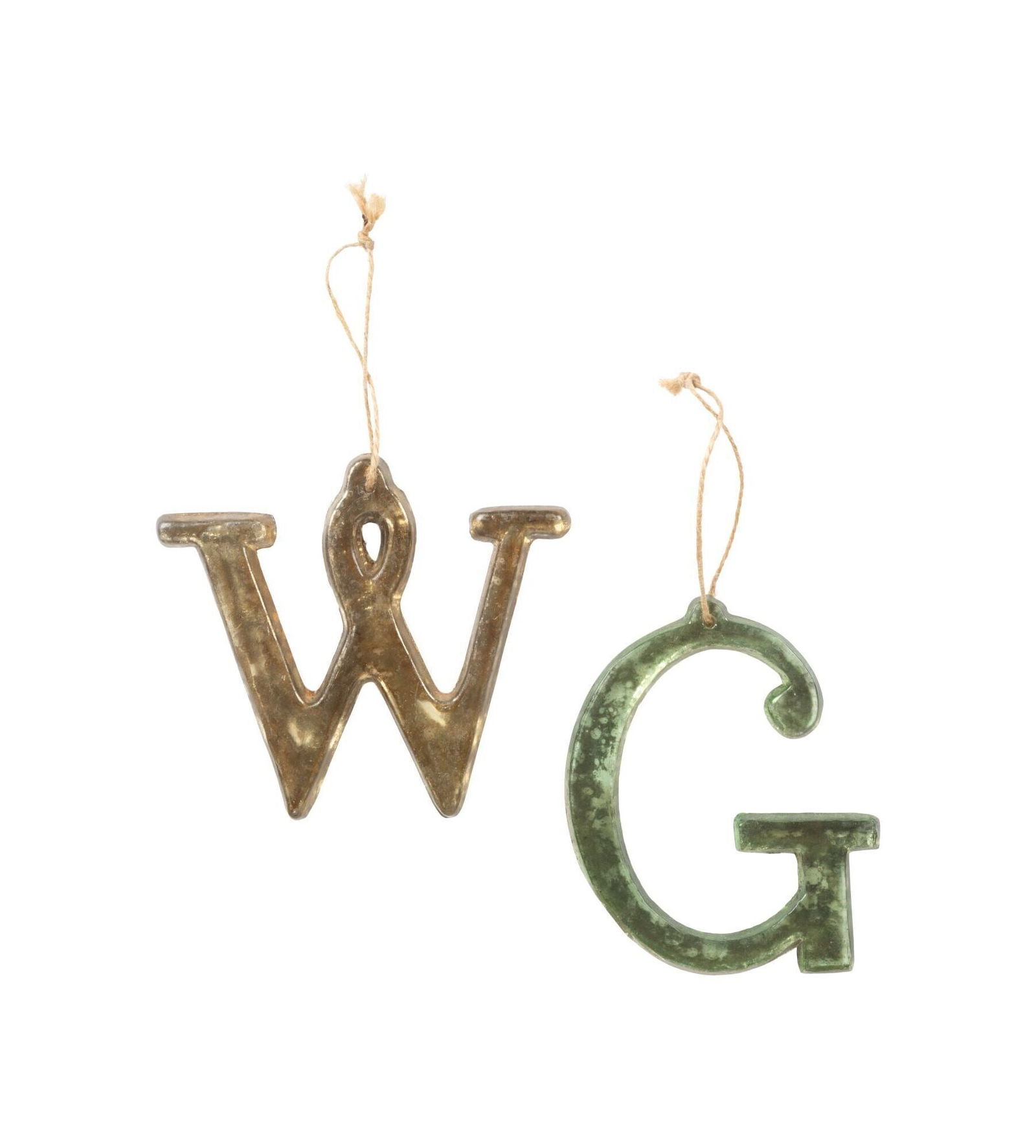 Whoopi Goldberg | Mercury Glass W G Ornaments and Book: Two modern mercury glass letter ornaments, a silvered "W" and a green "G."LITERATURE: Whoopi Goldberg: The Unqualified Hostess (NY: Rizzoli 2019), illustrated on page 1. 4.5 x 4.5 inches From the Coll