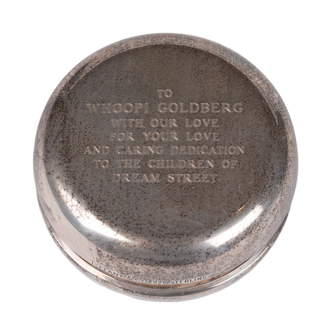 Whoopi Goldberg | Tiffany & Co. Sterling Yo-Yo and Book: An engraved sterling Tiffany & Co. yo-yo dated 1994 reading "To Whoopi Goldberg/ With Our Love for Your Love and Caring Dedication to the Children of Dream Street." Marked "Tiffany & Co. 925 Sterling.