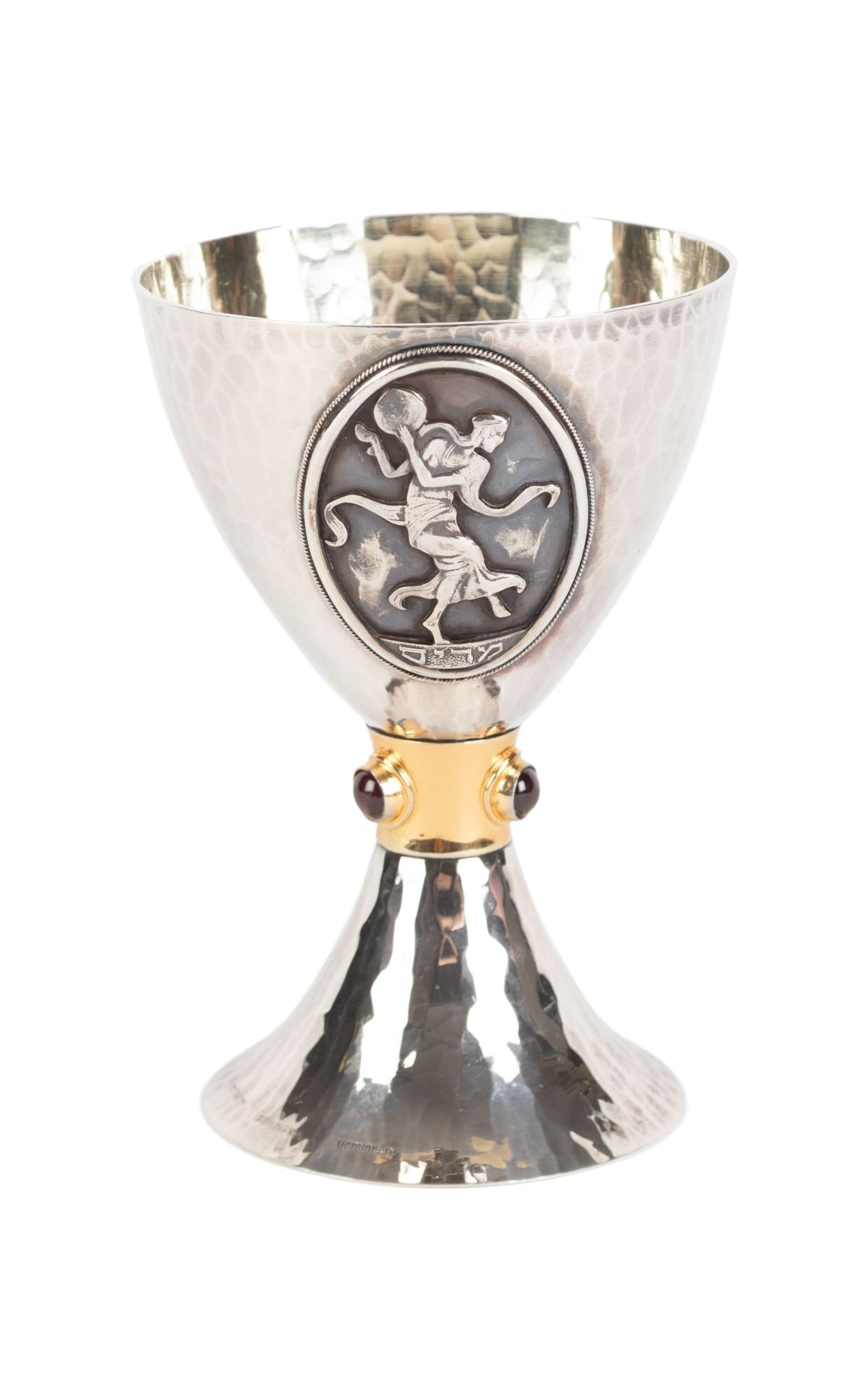 Whoopi Goldberg | Yemini Miriam Kiddush cup: A sterling silver and vermeil Kiddush cup decorated with an emblem of Miriam the Prophetess and inset with three cabochon garnets. Marked with edition number 36/360, sterling 925, and the Yemeni logo
