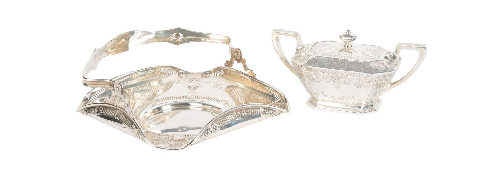 Whoopi Goldberg | Sterling Bread Basket and Covered Sugar Bowl: An American maker sterling bread basket with a handle, together with an American maker bright cut elongated octagonal covered sugar bowl. Late 19th/Early 20th century. Both marked on the underside. 21