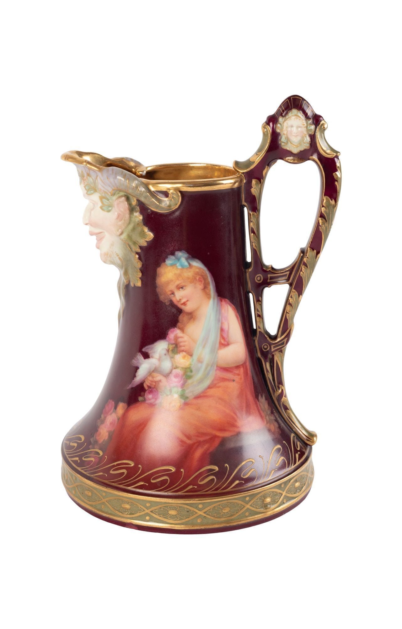 Whoopi Goldberg | Royal Vienna Style Porcelain Pitcher: A ruby porcelain pitcher with a faun spout parcel gilt and paint, decorated with a seated lady holding a bird and flowers. Multiple marks on the underside. Circa 1900. 8 x 5.25 From the Collection of
