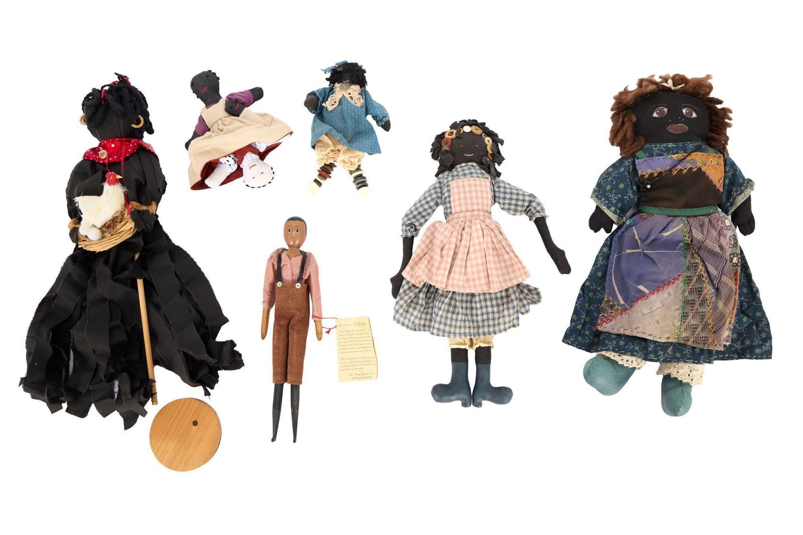 Whoopi Goldberg | Six Black Folk Art Dolls Antique & Reproduction: A group of six cloth and wood Black Americana dolls from Whoopi Goldberg's large collection, with handwritten notecards by Goldberg, numbering, naming, and categorizing them. Goldberg has categorized
