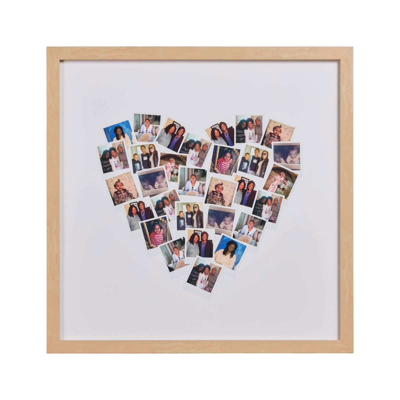 Whoopi Goldberg | Heart-Shaped Family Photos Collage Frame: A framed piece featuring a collage of photographs of Whoopi Goldberg and members of her family in the shape of a heart. Some duplicate photos present. Minor adhesive residue present on the glass. Fram