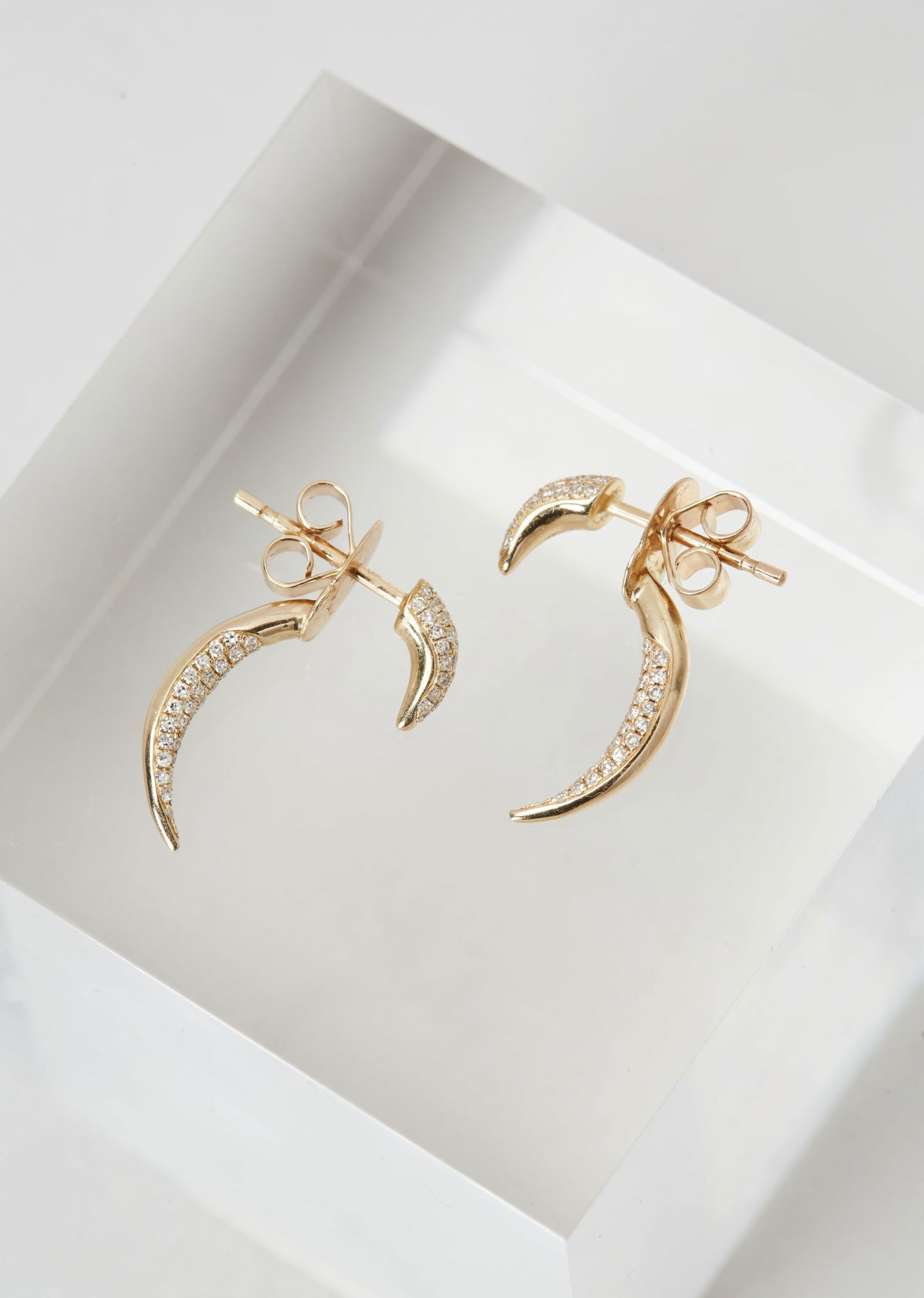 Gwyneth Paltrow | SHY Gold and Diamond Horn Earrings: SHY, 14K Yellow Gold and Diamond “Horn” Earrings from the collection of Gwyneth Paltrow.Each earring is designed with a front-and-back double horn motif, accented with single-cut diamonds