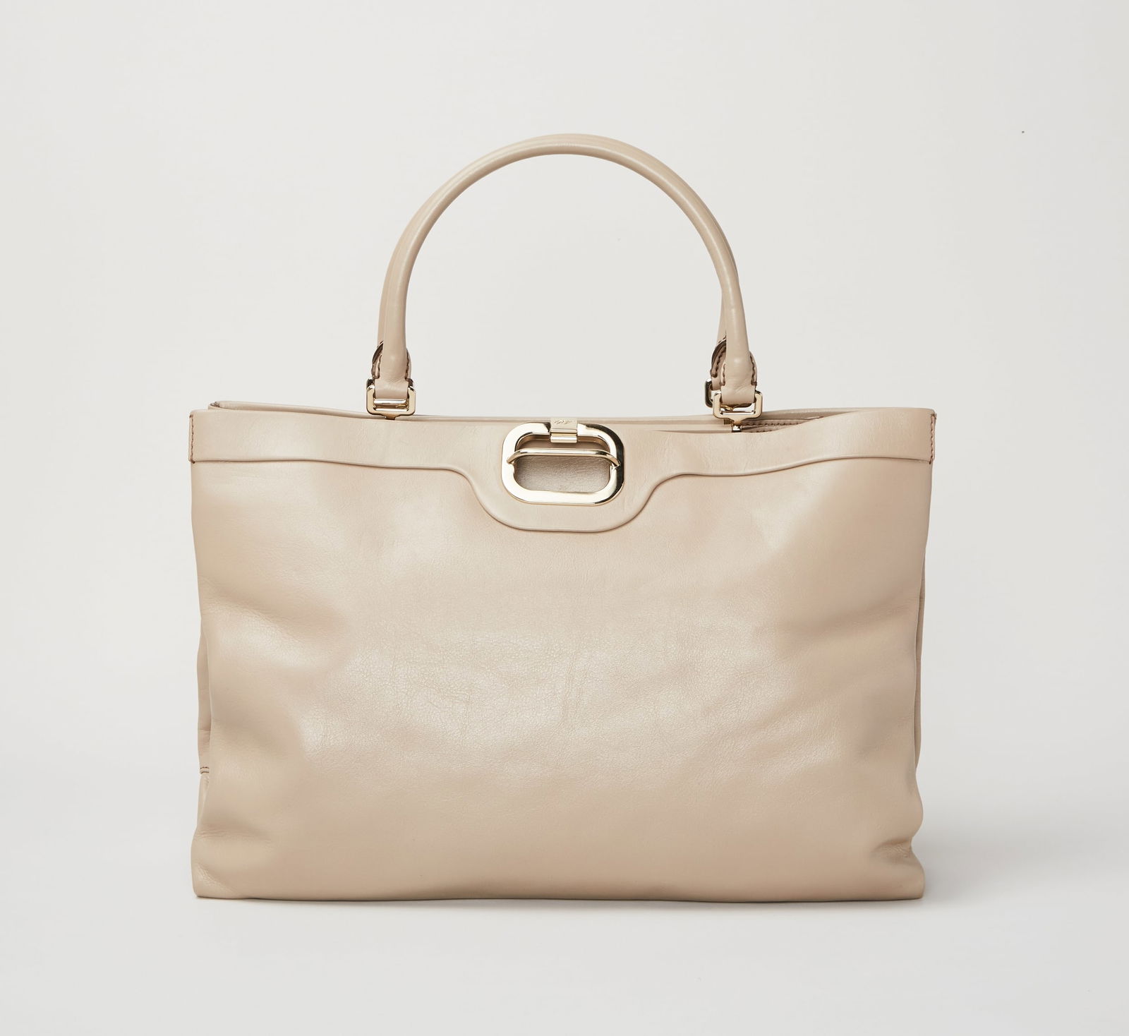 Gwyneth Paltrow | Roger Viver Handbag: A Roger Viver handbag from the collection of Gwyneth Paltrow. A taupe leather handbag in a structured rectangular shape with three internal compartments. The design features an expandable ac