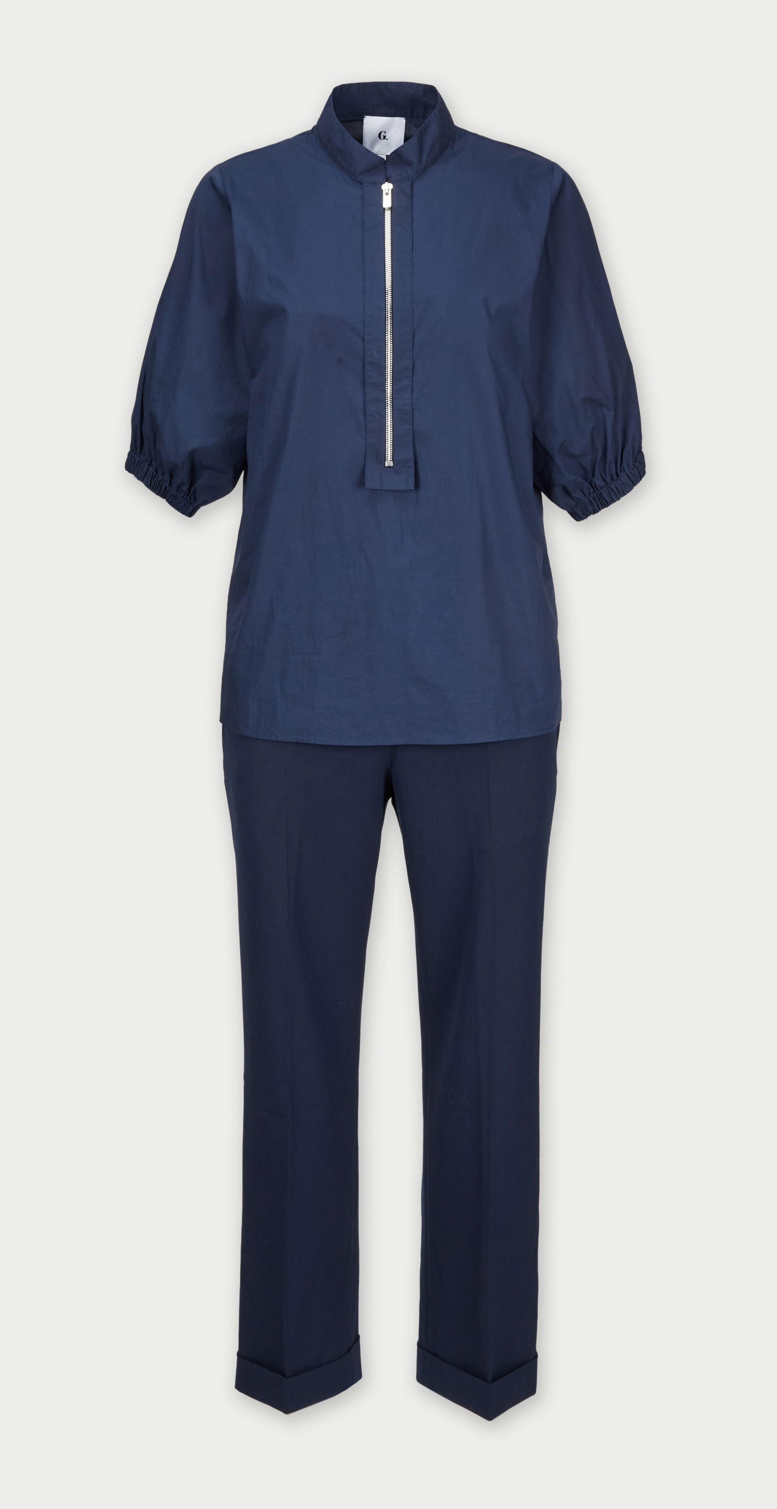 Gwyneth Paltrow | goop G. Label Navy Ensemble: A G. Label two-piece ensemble in a deep navy tone from the collection of Gwyneth Paltrow.The short-sleeve top features a structured Nehru collar with a partial front zip closure and elasticized s