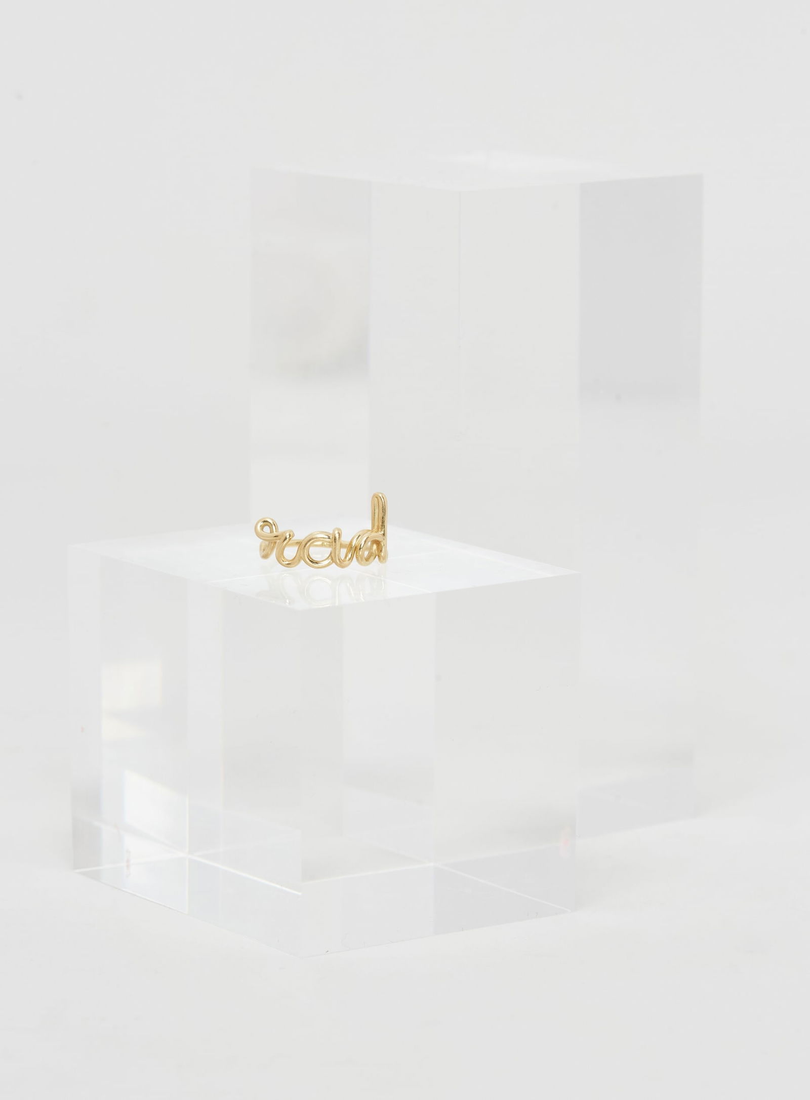 Gwyneth Paltrow | Solange Azagury 18k Yellow Gold rad Ring: A polished 18k yellow gold ring designed by Solange Azagury from the collection of Gwyneth Paltrow.Designed with a delicate cursive “rad” motif at the top. The ring is a size