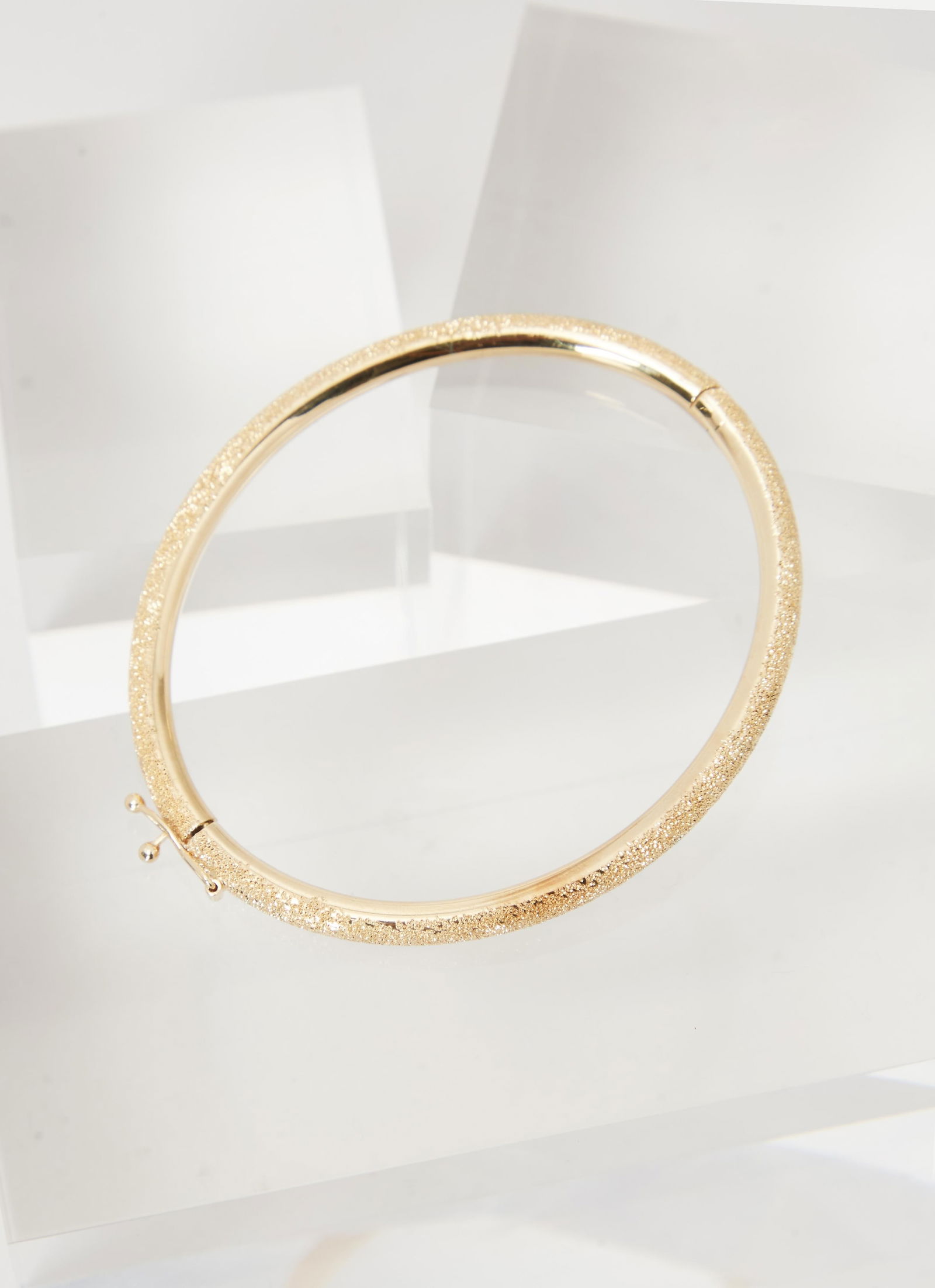 Gwyneth Paltrow | Carolina Bucci 18k Gold Bangle: Carolina Bucci 18k gold bangle from the collection of Gwyneth Paltrow. An 18k Gold thick bangle featuring clasp closure. Handmade in Italy. It comes with blue velvet