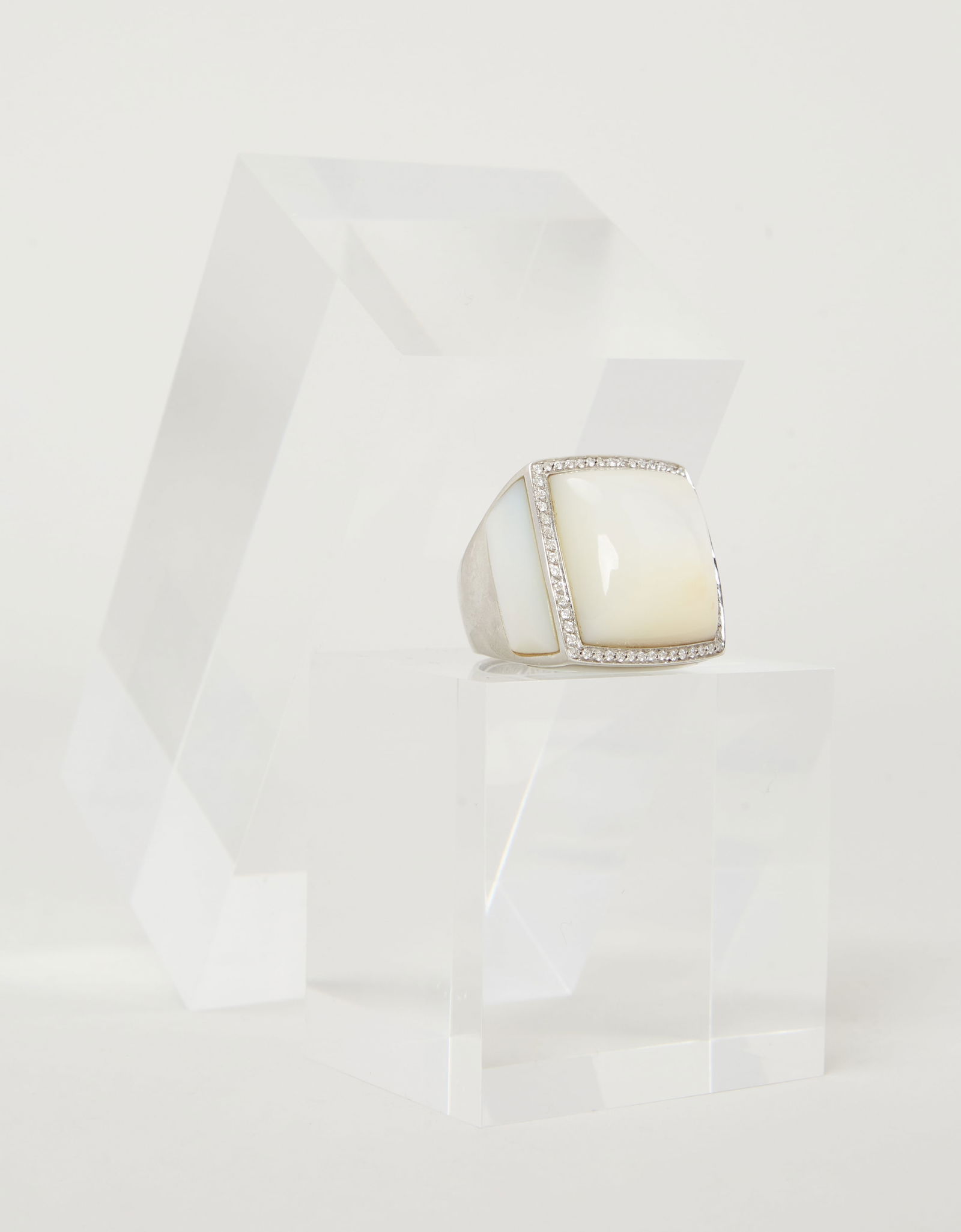 Gwyneth Paltrow | Catherine Prevost Mother of Pearl Ring: Catherine Prevost 18k white gold, diamond, and mother-of-pearl ring from the collection of Gwyneth Paltrow. The ring features a square cabochon mother-of-pearl center, framed by a circular-cut