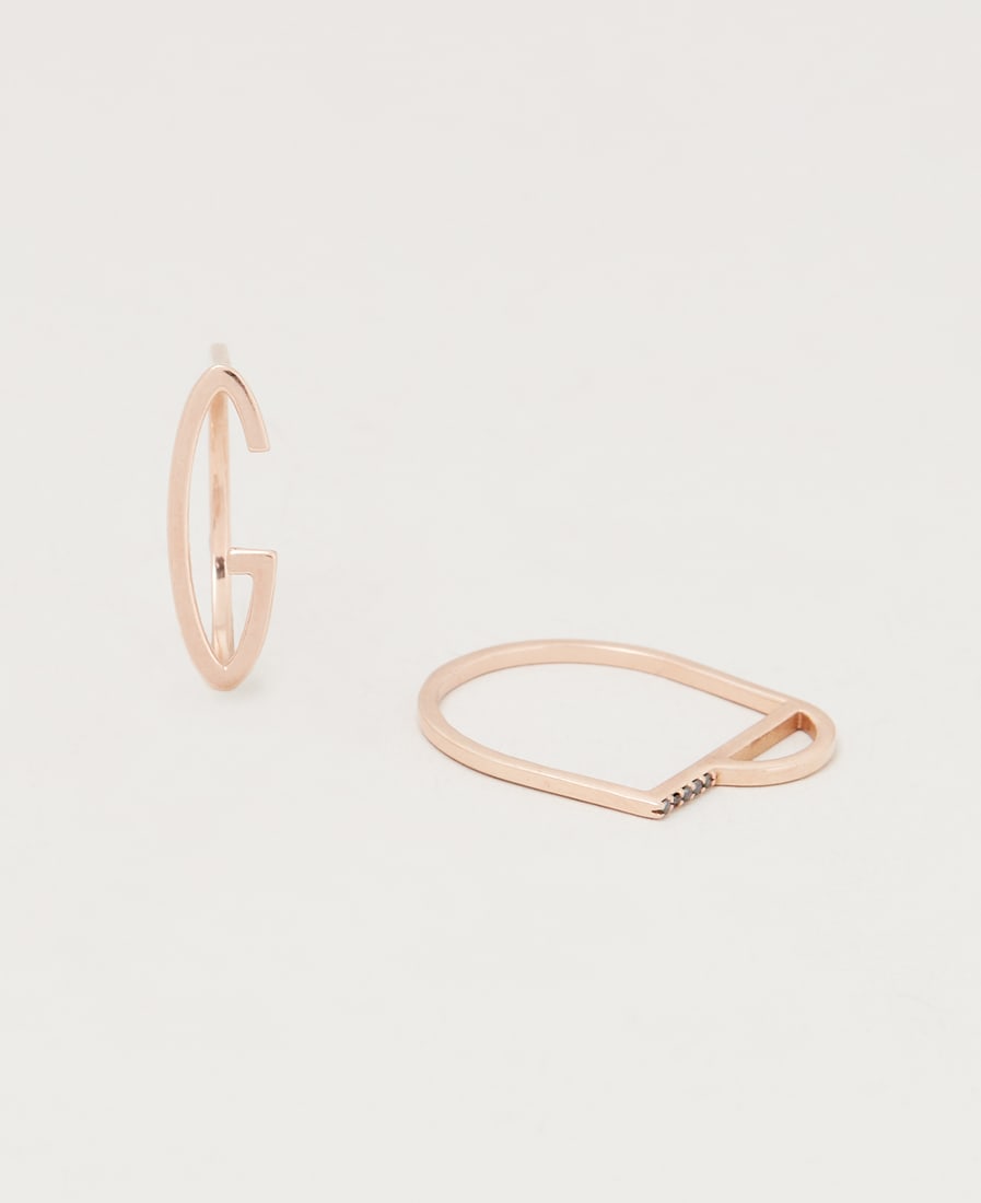 Gwyneth Paltrow | kWIT 14k Rose Gold and Black Diamond Rings: A set of 14k rose gold and black diamond initial rings designed by kWIT from the collection of Gwyneth Paltrow.Comprising two rings: one designed as the letter “G” and the other as th