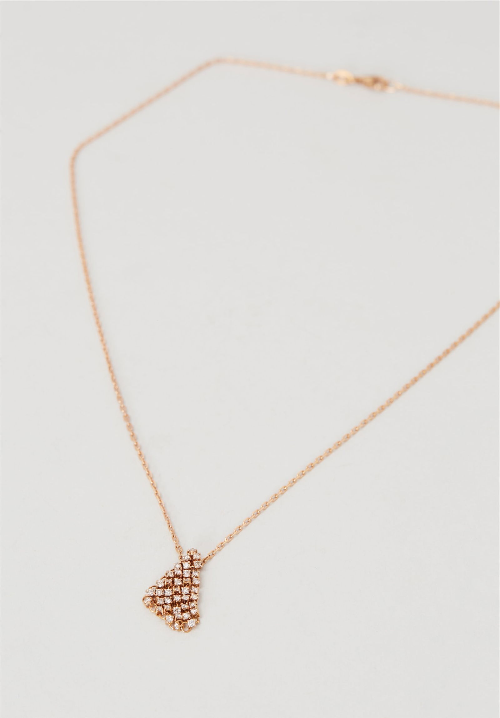 Gwyneth Paltrow | Dauphin 18k Rose Gold Diamond Fluid Pendant Necklace: A Dauphin 18k Rose Gold Diamond "Fluid" Pendant Necklace from the collection of Gwyneth Paltrow. Gwyneth Paltrow has partnered with Dauphin through her lifestyle brand, goop, which