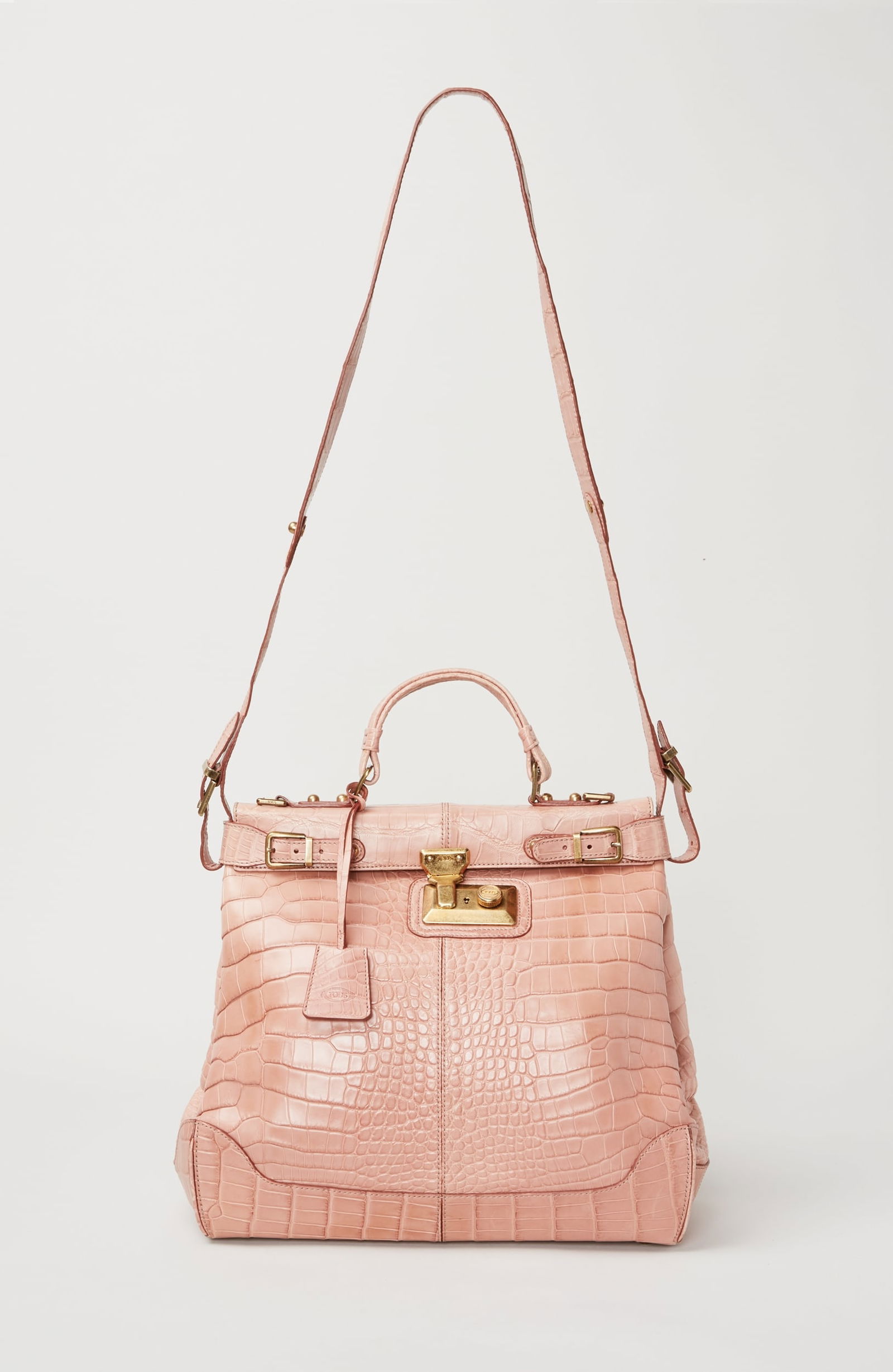 Gwyneth Paltrow | Tod's Dokt Handbag: A Tod’s blush-colored alligator Dokt handbag from the collection of Gwyneth Paltrow. The interior is fully lined in smooth chocolate-brown leather and features two open compartments.