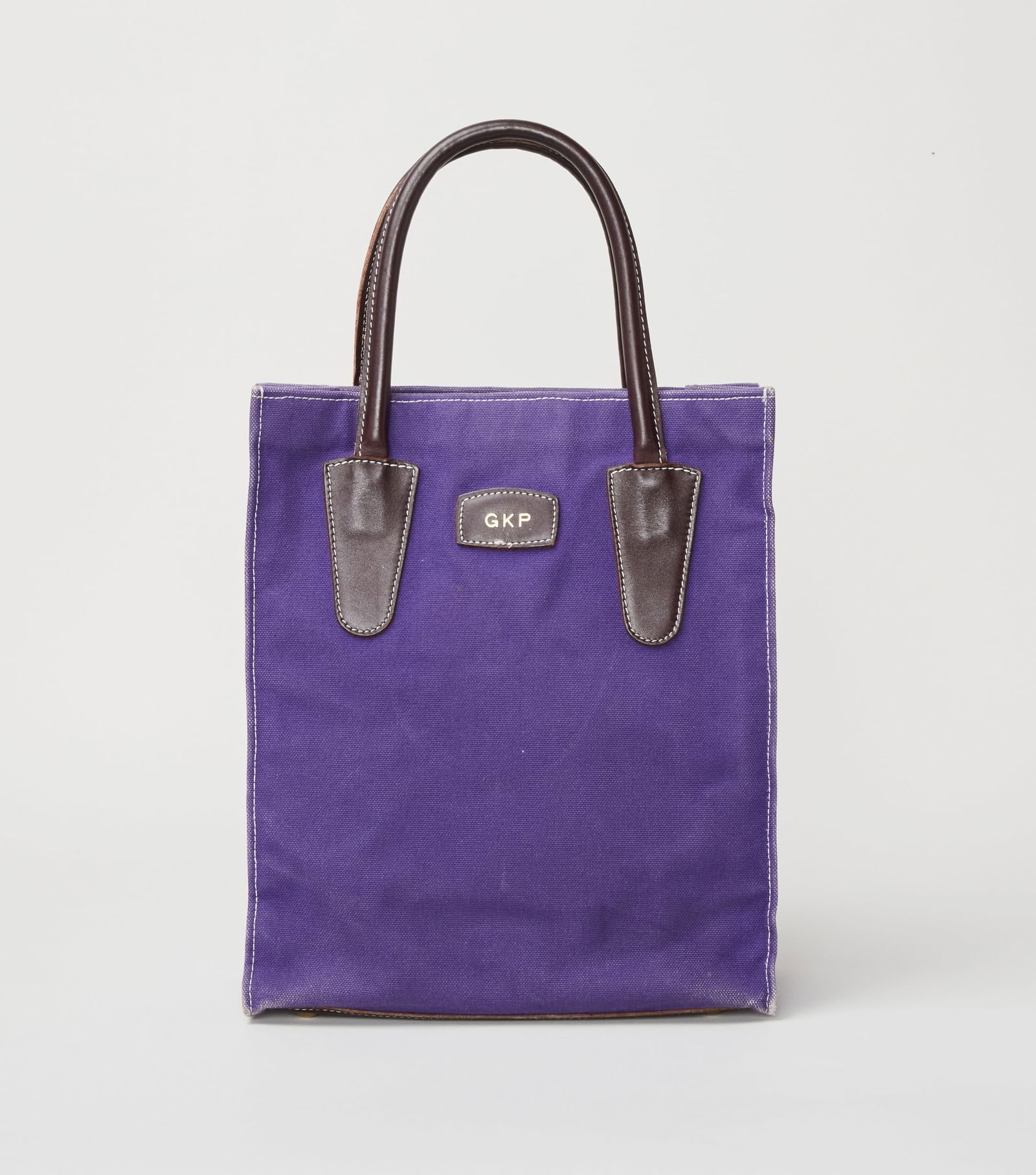 Gwyneth Paltrow | T. Anthony New York Tote Bag (With Signed Image): A T. Anthony New York purple and brown tote bag from the collection of Gwyneth Paltrow. Gwyneth was seen carrying this handbag on multiple occasions in 2001, and on August 3, 2021, she wore