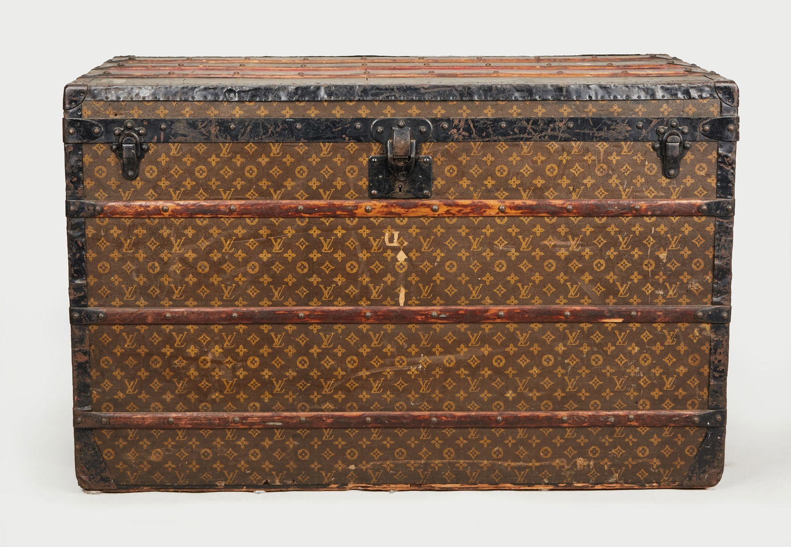 Gloria Swanson | Monogrammed Louis Vuitton Malle Courier Trunk : A Louis Vuitton Early 20th Century “Malle Courier” canvas monogram trunk belonging to Gloria Swanson. The trunk was originally offered on September 22, 1983 from the Estate of Gloria Swans