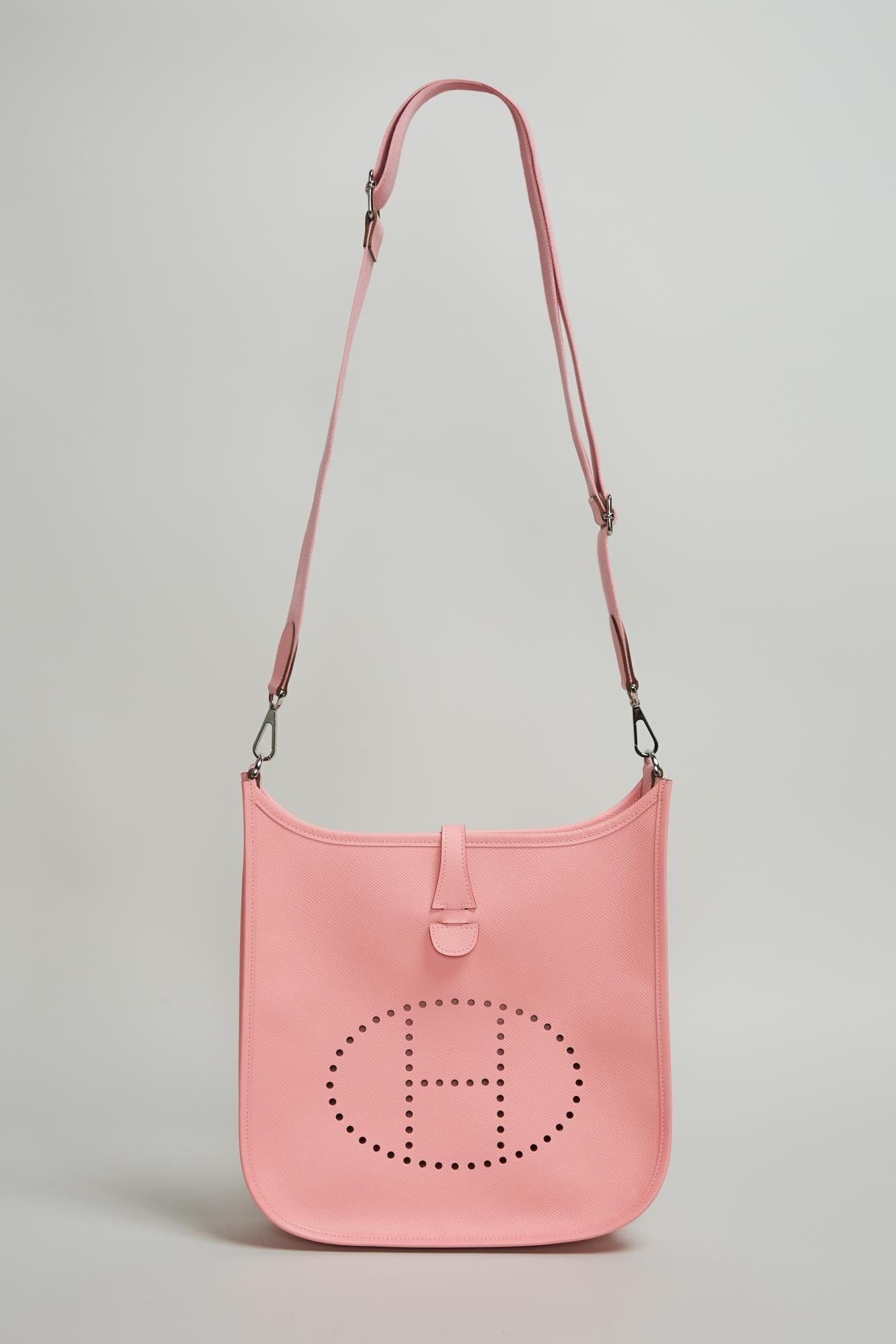 Hermès | 2016 Rose Confetti Epsom 29 Evelyn III: An Hermès Evelyn Rose Confetti Epsom leather III, 29 cm, with matching canvas crossbody strap from 2016. Evelyn comes with original packaging, including dust bag, box, and leather care