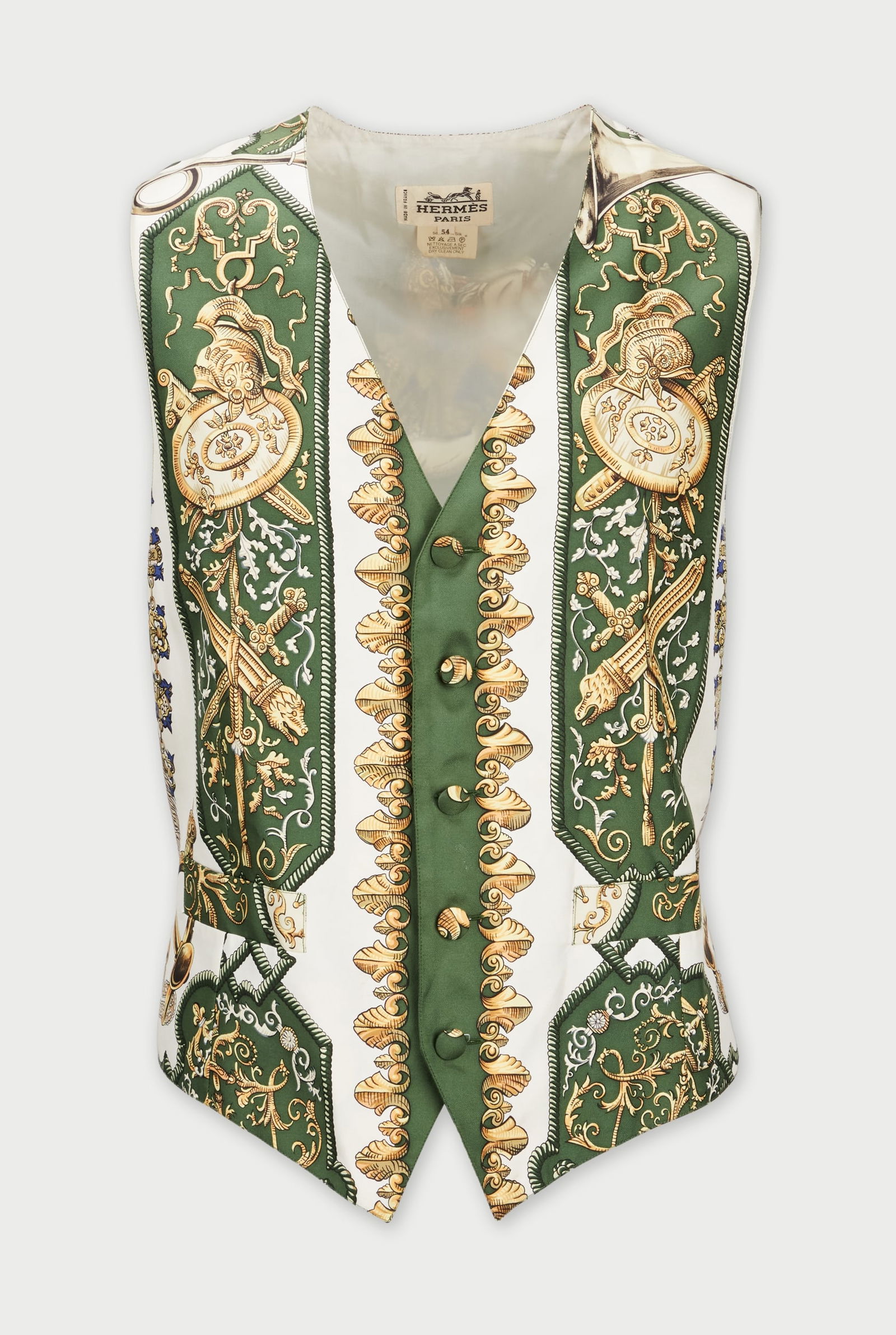Hermès | Silk Waistcoat: A Hermès silk waistcoat, from the collection of Cameron Silver. The 100% white silk vest contrasted by rich forest green panels and exquisitely detailed baroque motifs in gold and black.