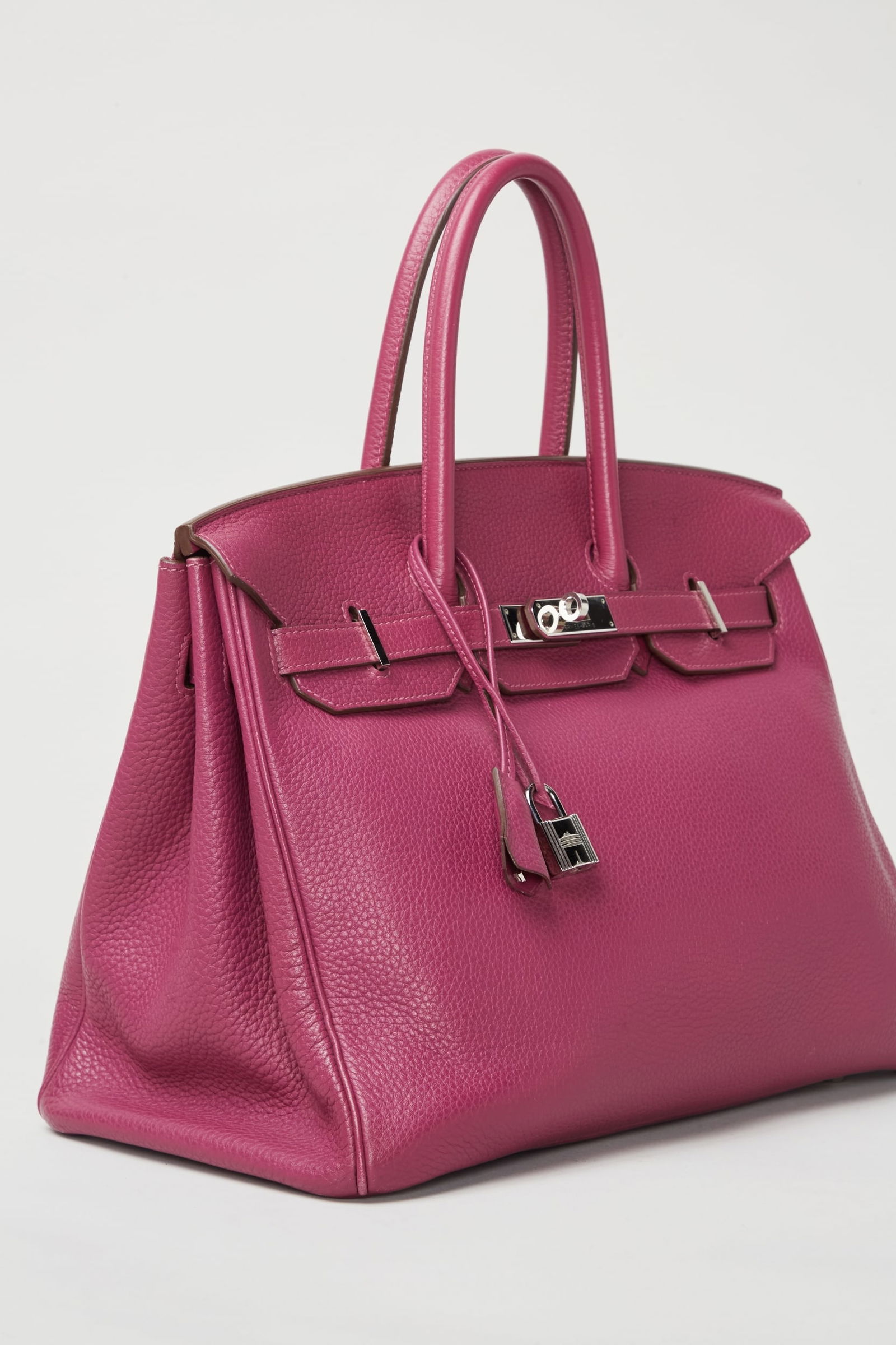 Hermes | 2011 35 CM Birkin Tosca Clemence Leather Handbag : An Hermes retourné 35 cm, Tosca, Clemence (calf leather) Birkin with palladium hardware, lined with goat leather. The design features rolled top handles, gold-plated hardware that includes the