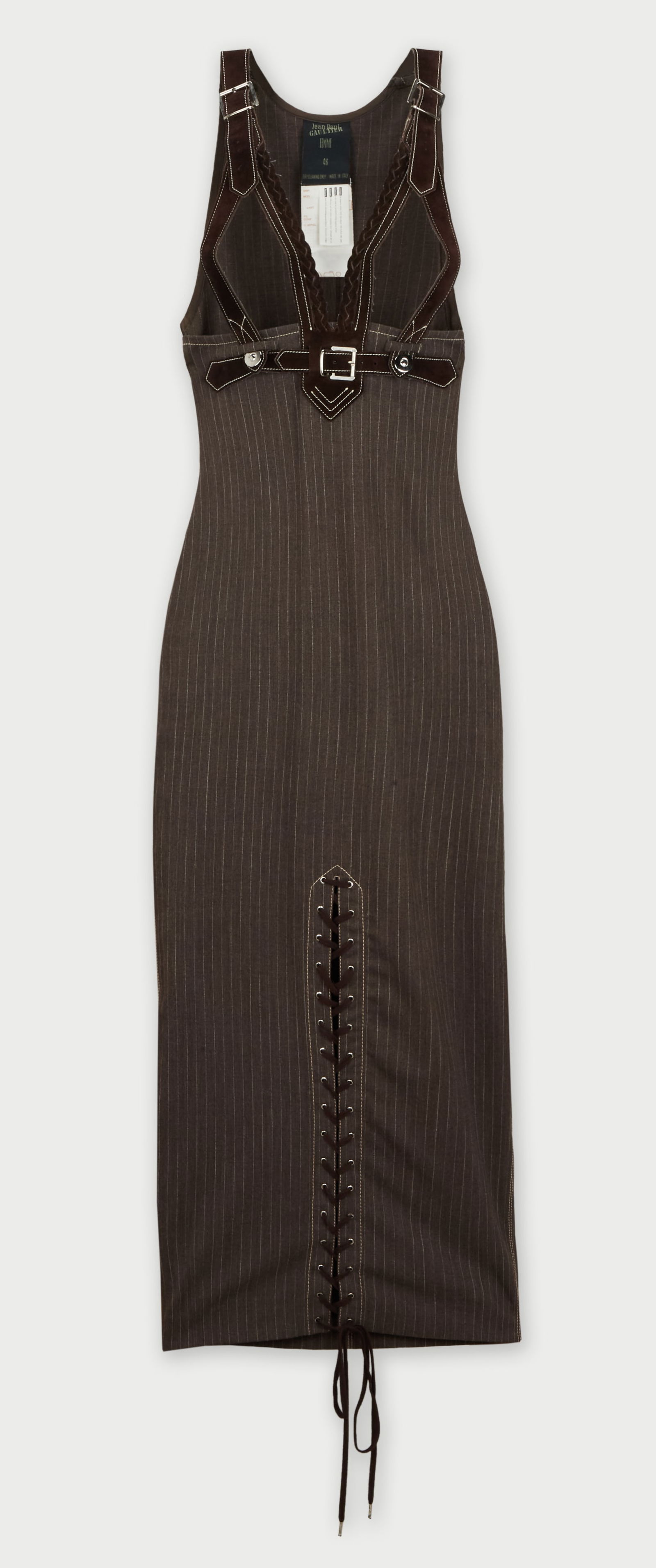 Jean Paul Gaultier | 1992 Fall Runway Suspender Dress: This is a true Gaultier design, provocative, the design leaves little to the imagination with suede suspenders and formfitting wool pin-stripe dress that starts below the bust and continues to the