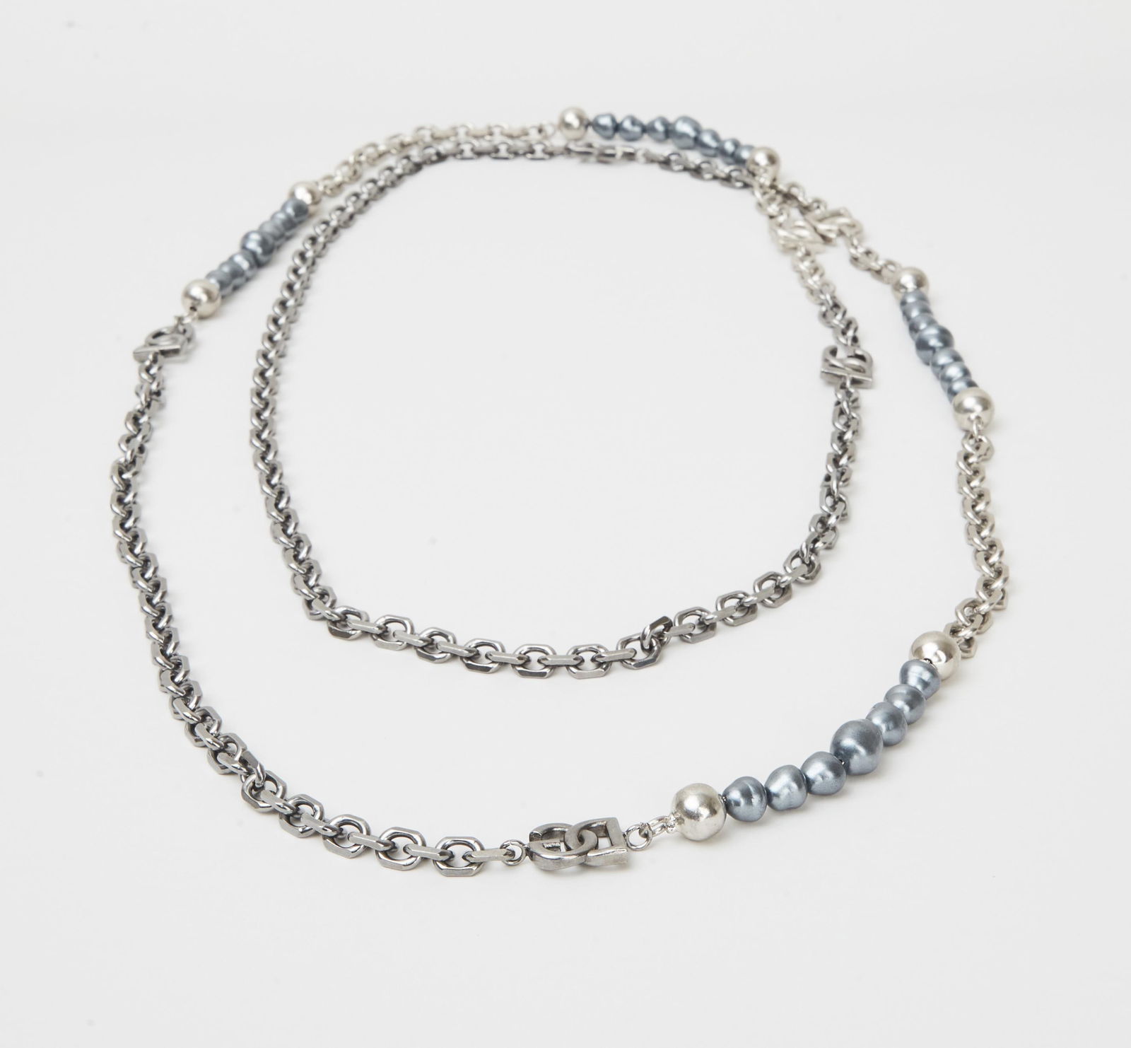 Dolce and Gabbana | Gunmetal and Faux Pearl Necklace: Dolce & Gabbana, Gunmetal and faux Pearl long chain necklace form the collection of Cameron Silver.The gunmetal link necklace, spaced by gunmetal beads, with DG logo links and simulated baroque black