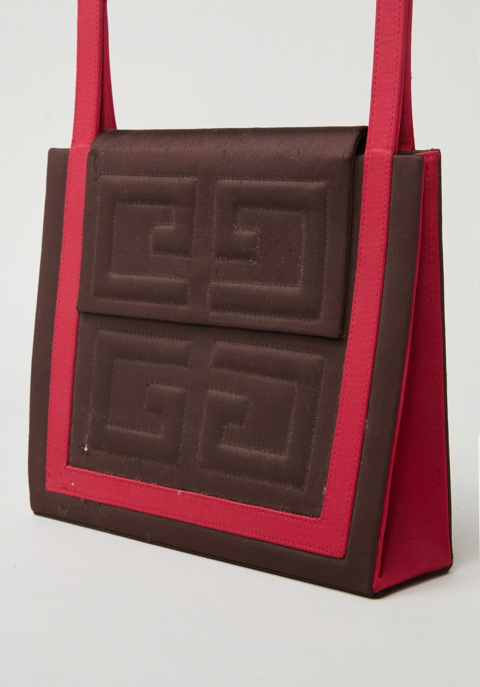 Givenchy | Sample Logo Top-Handle Handbag: A market (buy week) sample Givenchy top-handle handbag, not put into production, designed during Alexander McQueen's tenure as creative director at Givenchy.The smooth dark brown satin handbag with a