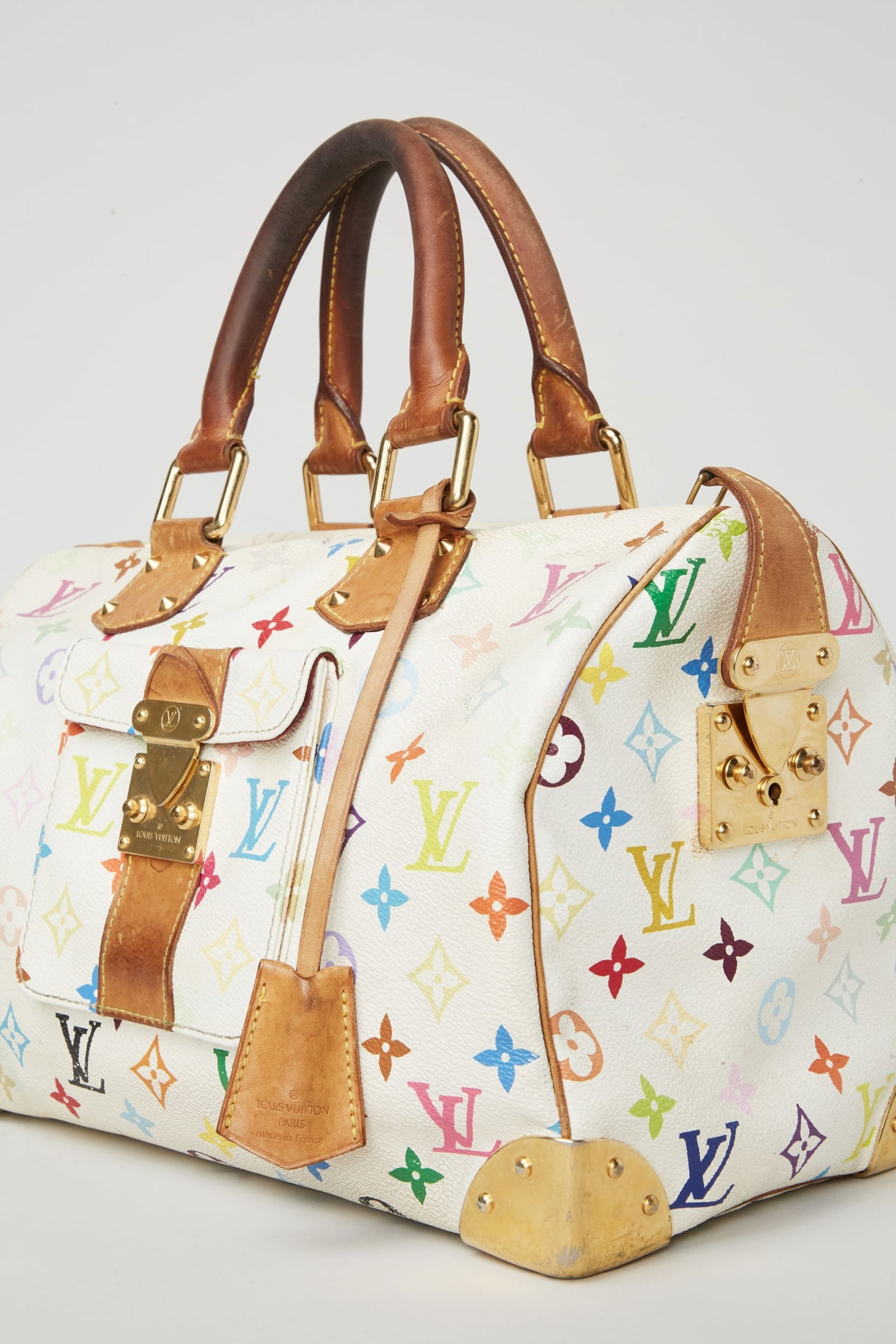 Louis Vuitton | 2003 Spring Speedy 30 Handbag: Louis Vuitton Monogram Multicolore Speedy 30 handbag, from the Spring/Summer 2003. The style was famously worn by Jessica Simpson on the television series Newlyweds. Zendaya the House Ambassador for