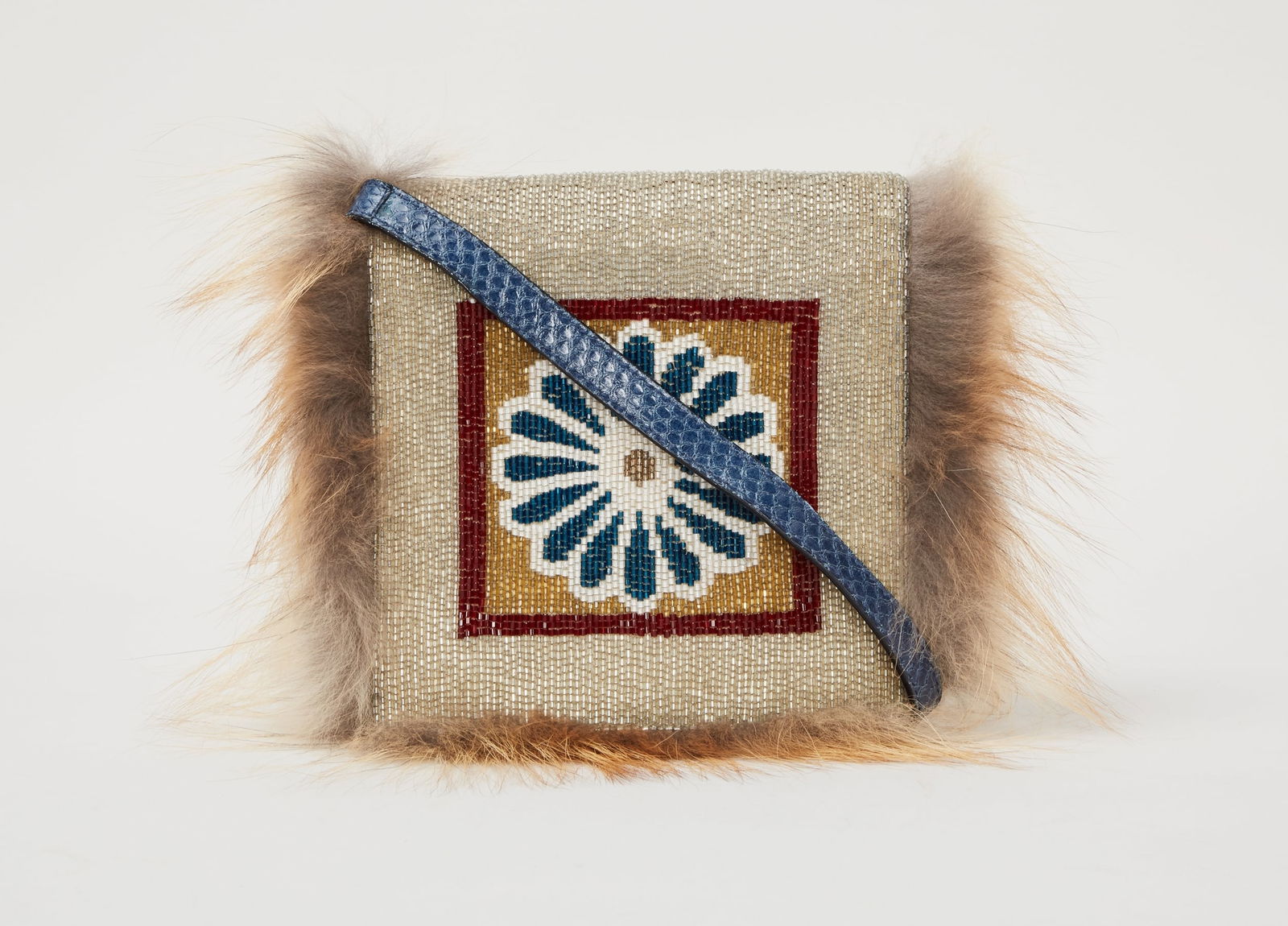 Fendi | 2012 Spring Ready to Wear Beaded Daisy Bag: Fendi Beaded Daisy Bag from the Summer 2012 Ready to Wear (look 41) modeled by Toni Garrn.Fendi beaded snakeskin and fox fur crossbody clutch bag. The front flap is decorated with multicolor beadwork