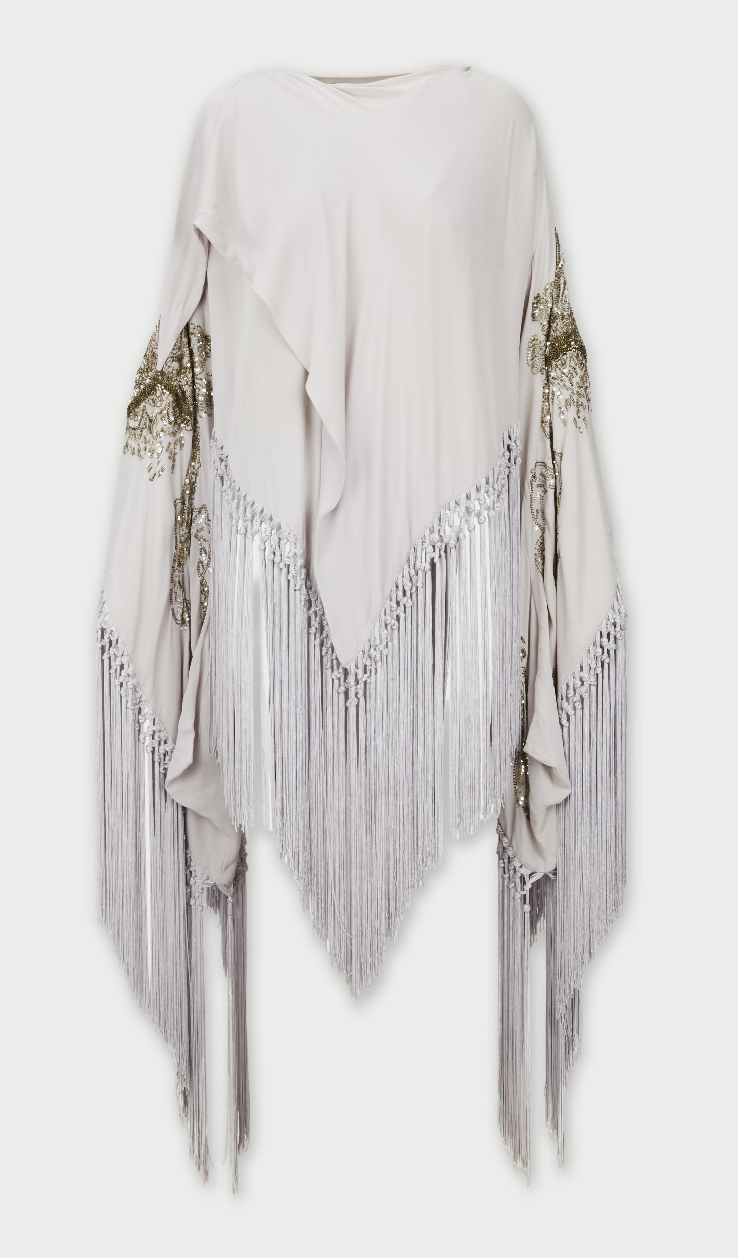 Roberto Cavalli | Lavender Silk Fringe Blouse: Roberto Cavalli lavender silk fringe blouse. The blouse features a round neckline, relaxed draped bodice, and long wide sleeves. Sleeves are embellished with ornate metallic bead and sequin