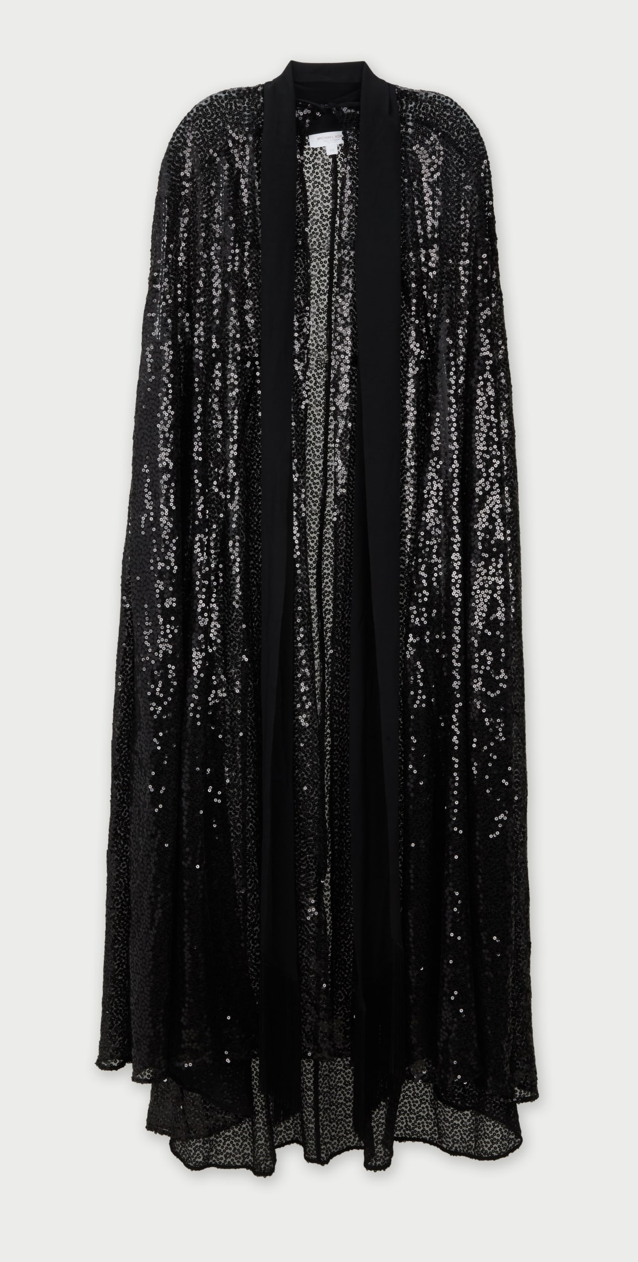 Michael Kors Collection | 2023 Sequin Chiffon Cape: Michael Kors sequin cape from the Fall/Winter 2023 runway, from the collection of Cameron Silver.A floor length sequin sheer black cape with a long black scarf and clasp attached to the neck. Size