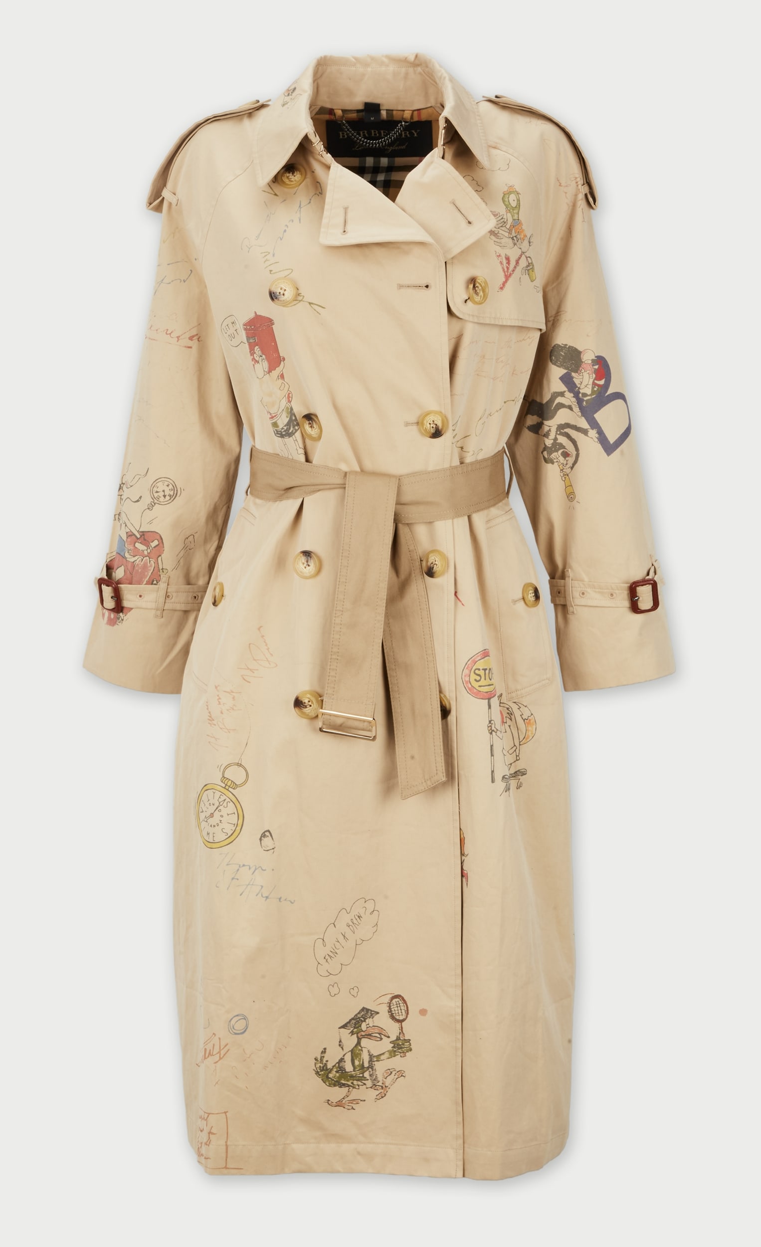 Burberry | 2017 Beige Graphic Trench Coat: Burberry beige graphic trench coat from the Fall 2017 Ready to Wear collection. A similar graphic style jacket was modeled by Karlis Leiboms (look 14).The cotton mid-length trench coat features a doub