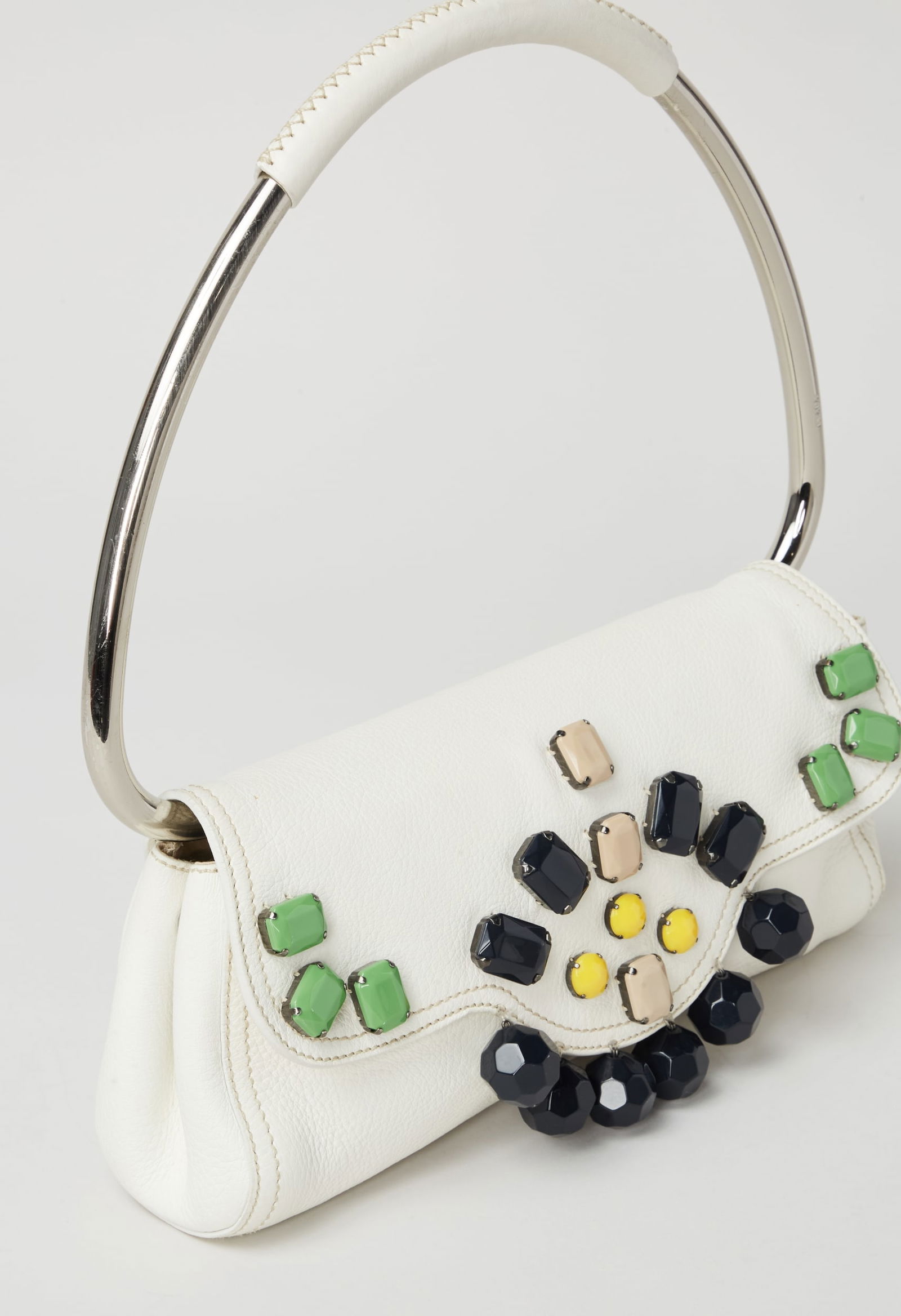 Prada | 2003 Spring Flap Bag: Prada white leather embellished flap bag from the Prada Spring 2003 Ready to Wear runway show. A single handle clutch with an embellished front flat that opens to a satin interior with a zip